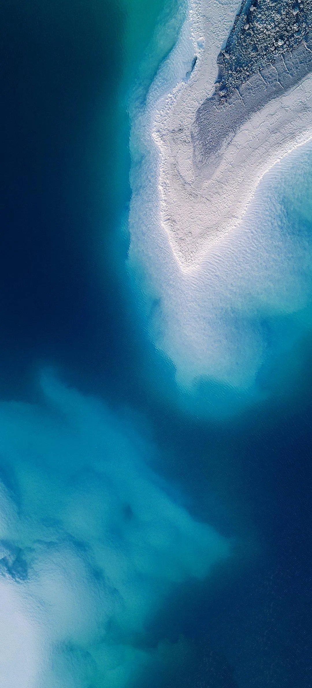 Aerial Ocean Shoreline with Soft Blue and White Tones