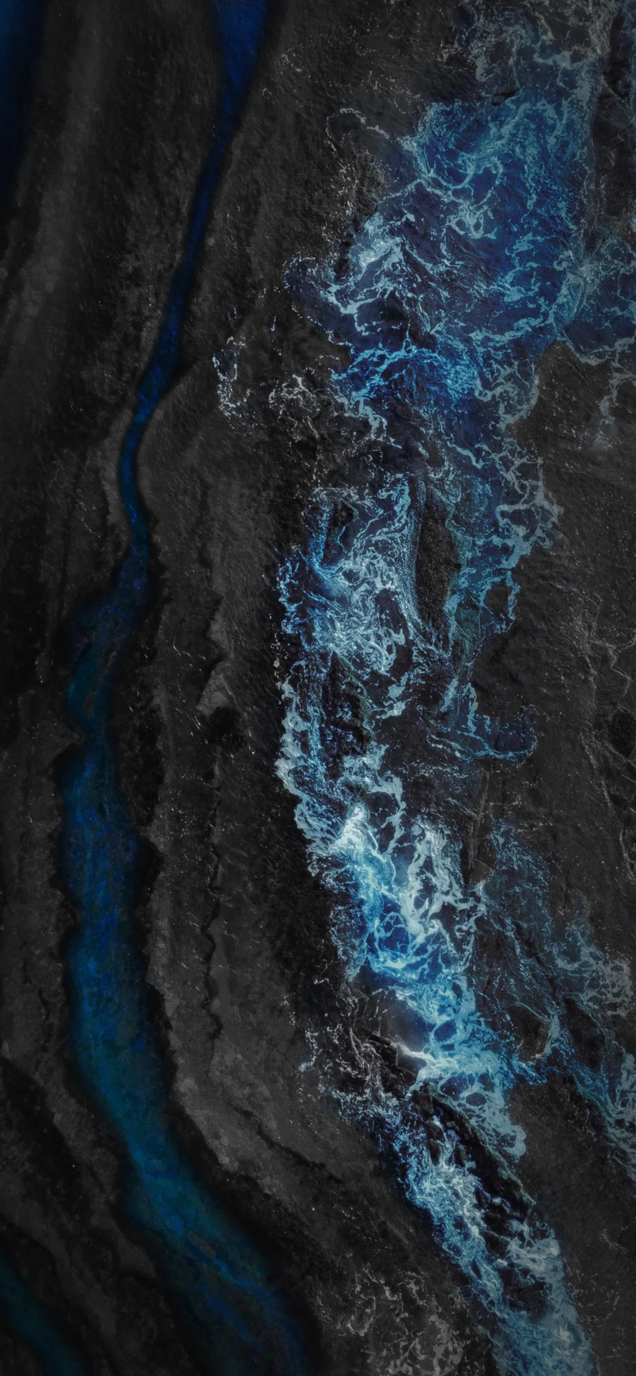 Aerial Shot of Rugged Canyon and River Through Cliffs