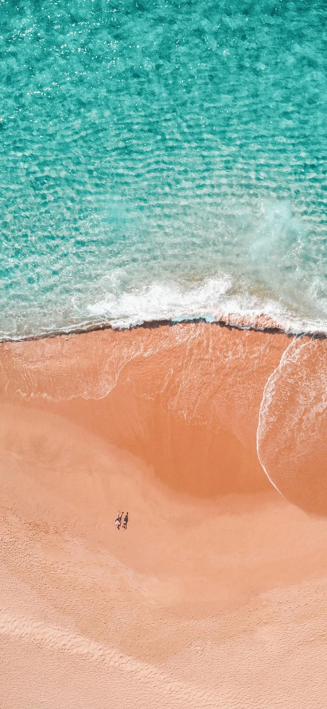 Aerial View of Beach and Ocean Waves Meeting Sand image