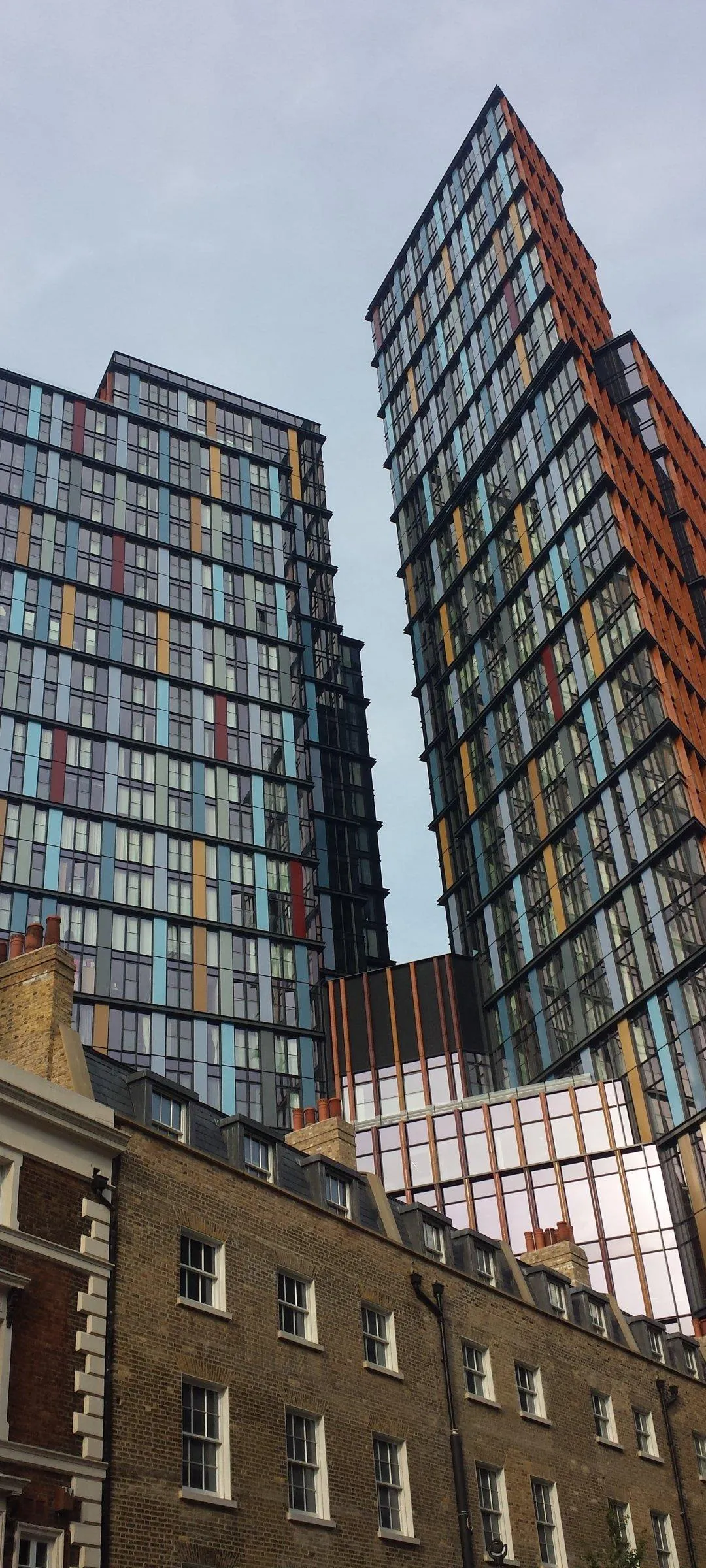 Architectural Glass Buildings Under Bright Sky View