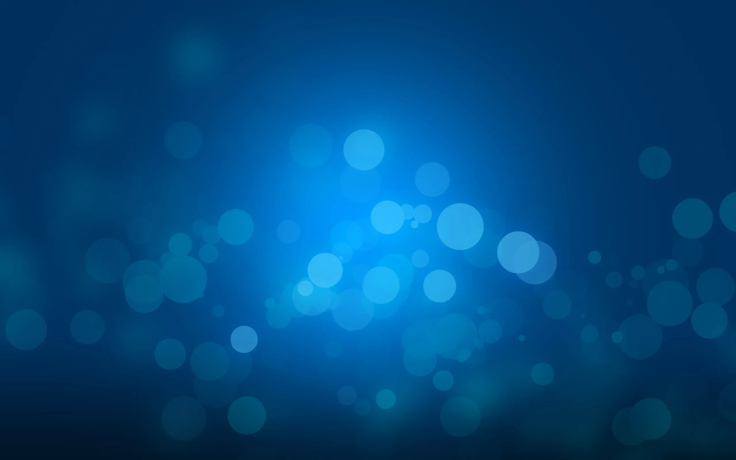 Beautiful glowing blue bokeh wallpaper in high resolution