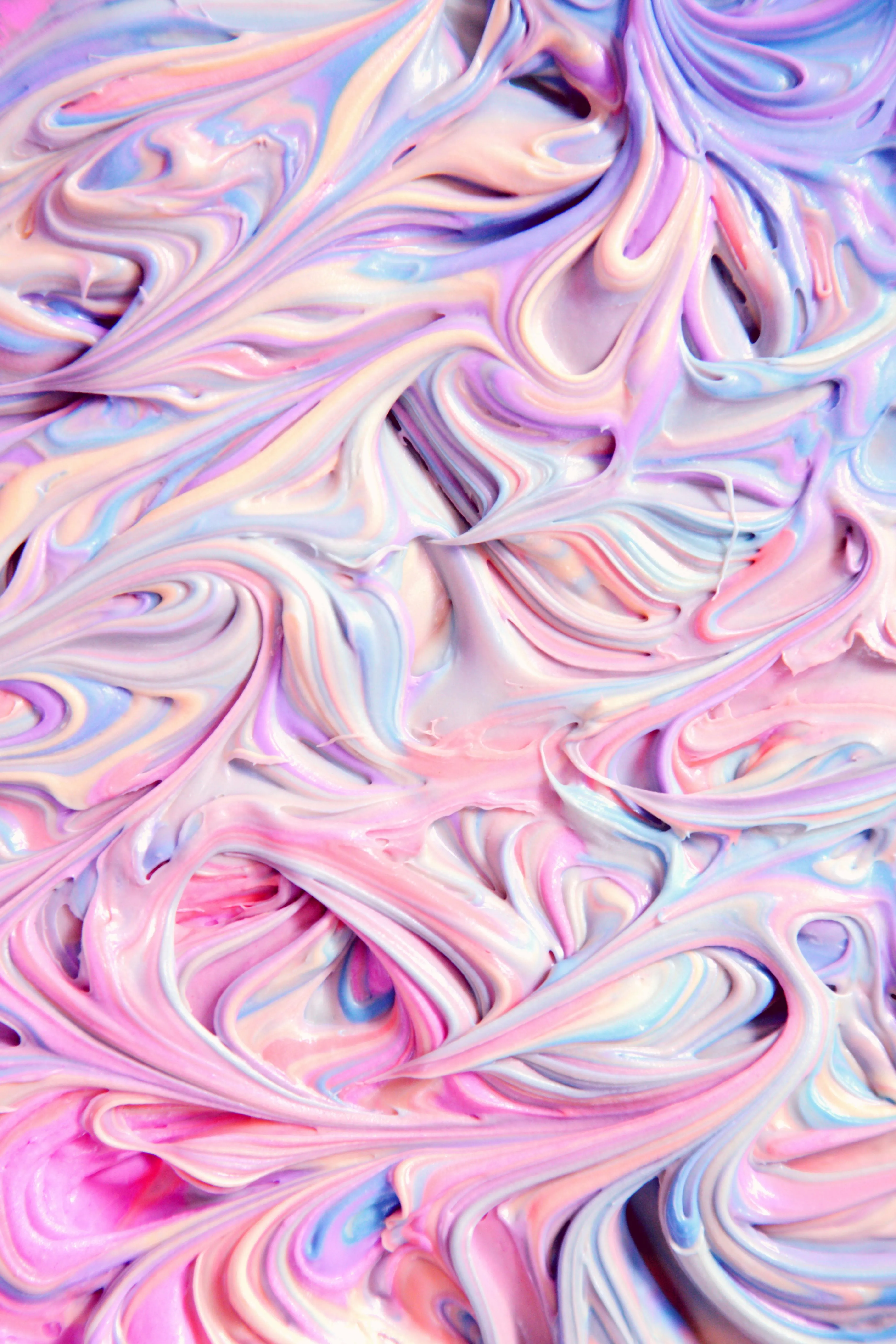 Beautiful swirls of pastel pink blue and white paint art