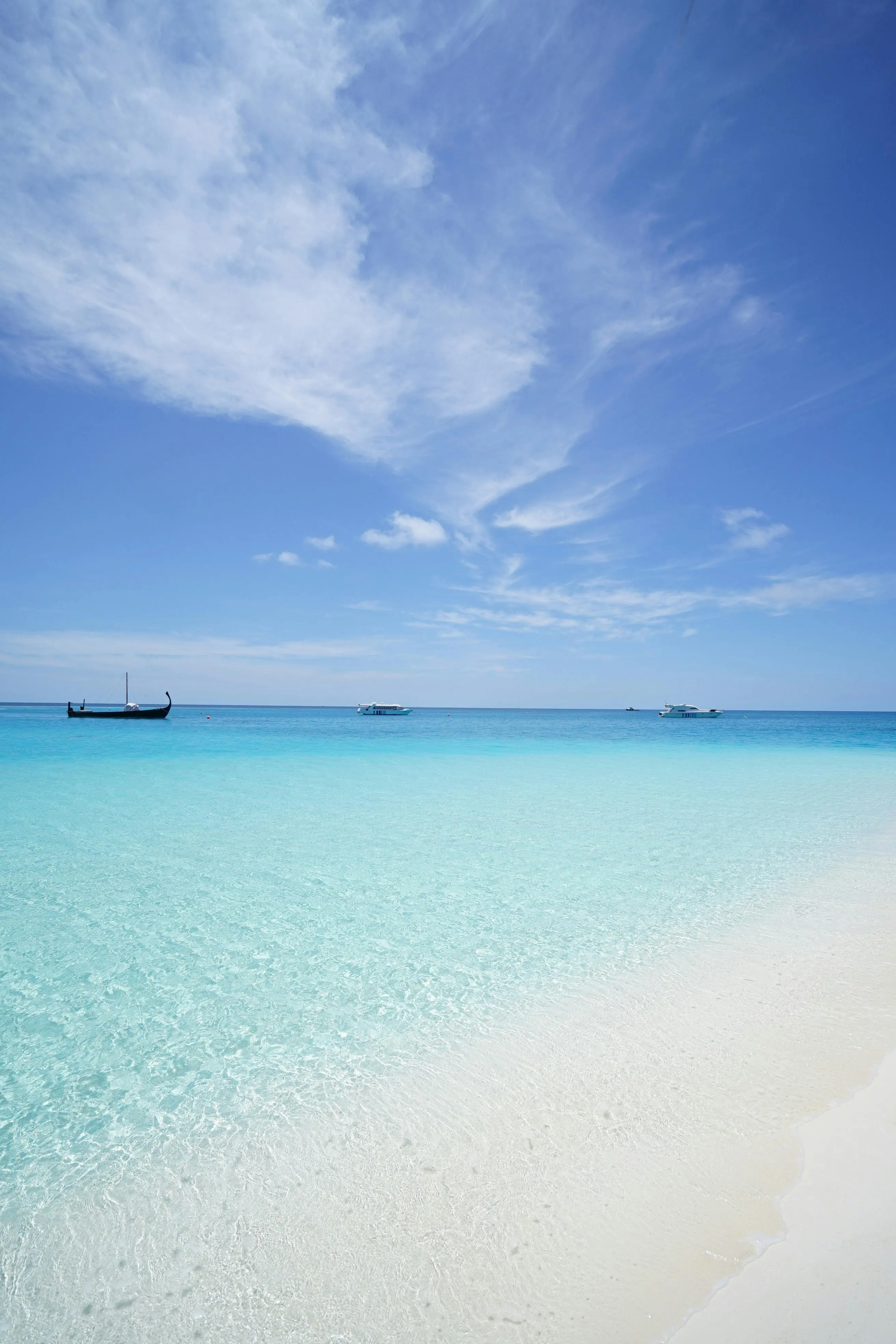 Beautiful tropical beach with white sand and cloudy sky