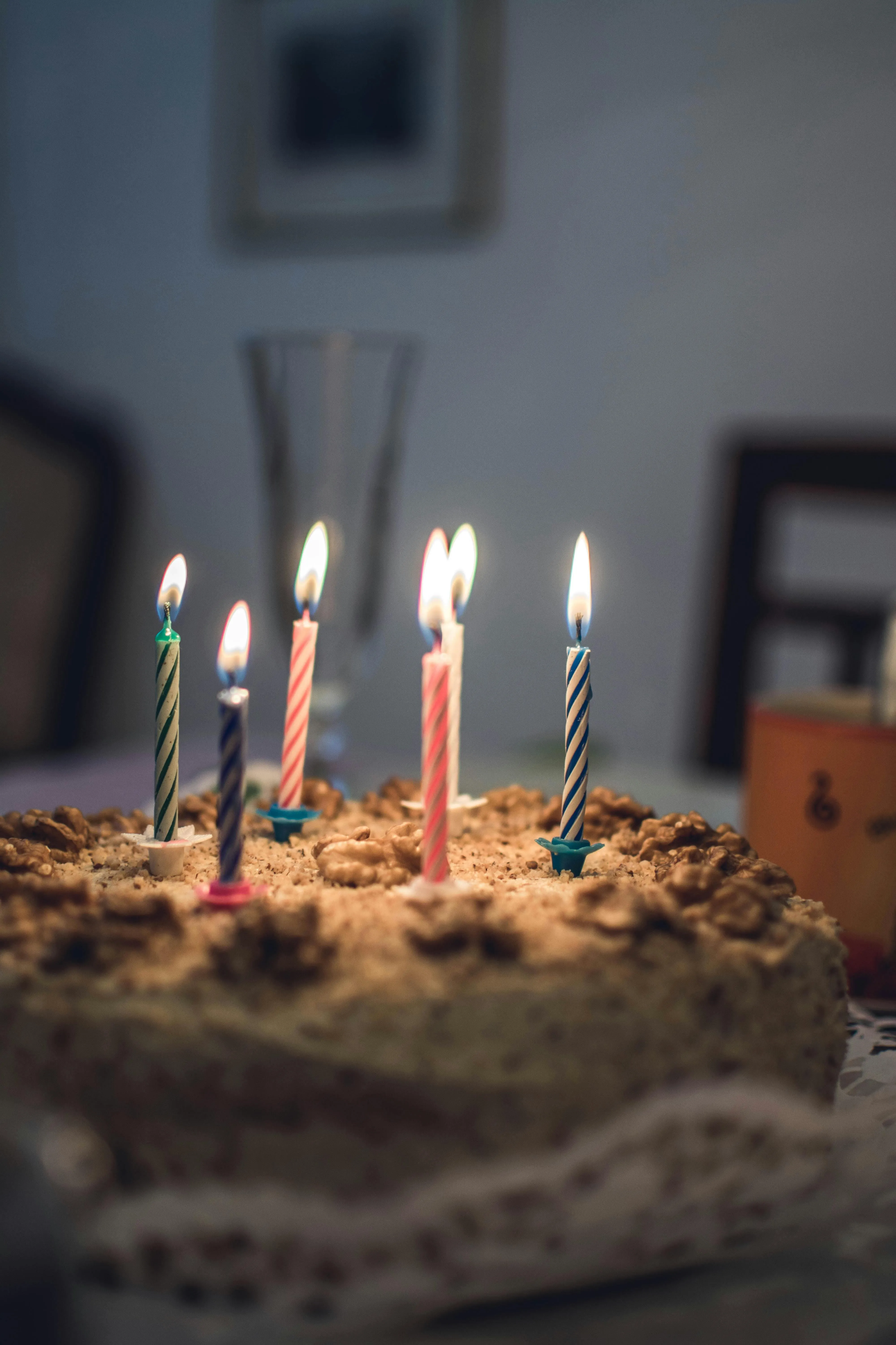 Birthday cake with candles in a cozy indoor setting image