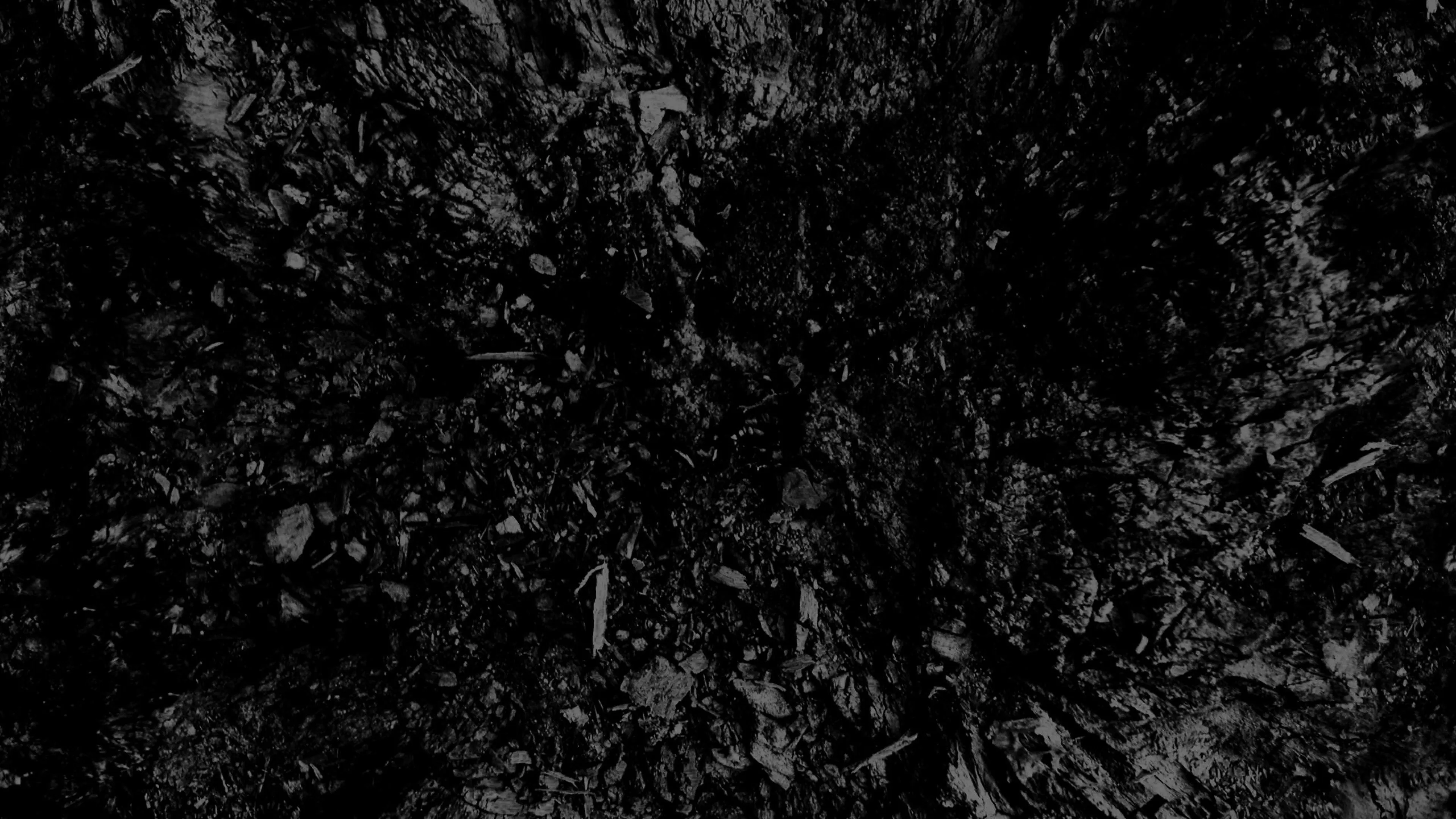 Black rough textured surface with an abstract uneven look