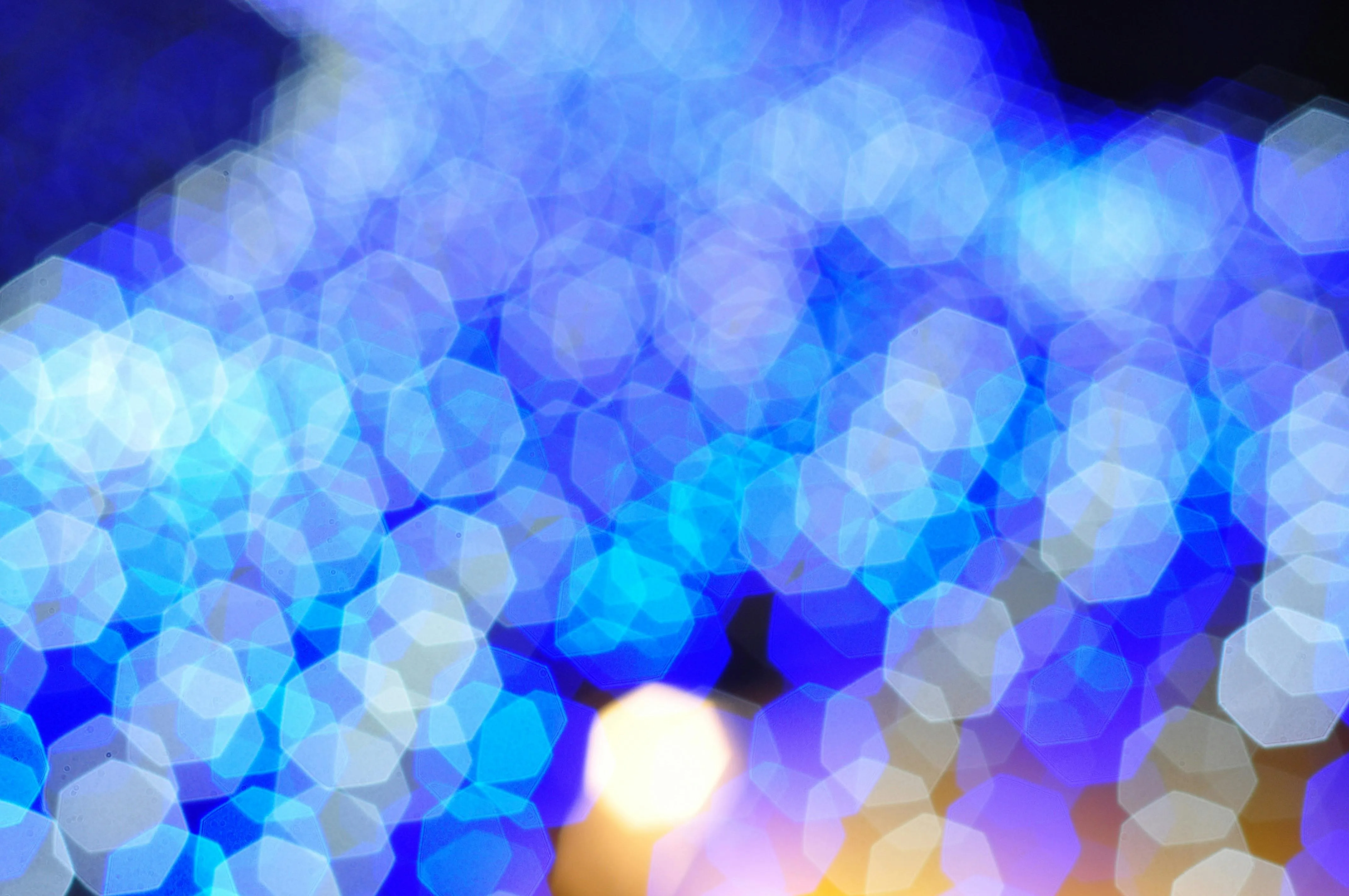 Blue bokeh lights creating a dreamy glowing abstract effect
