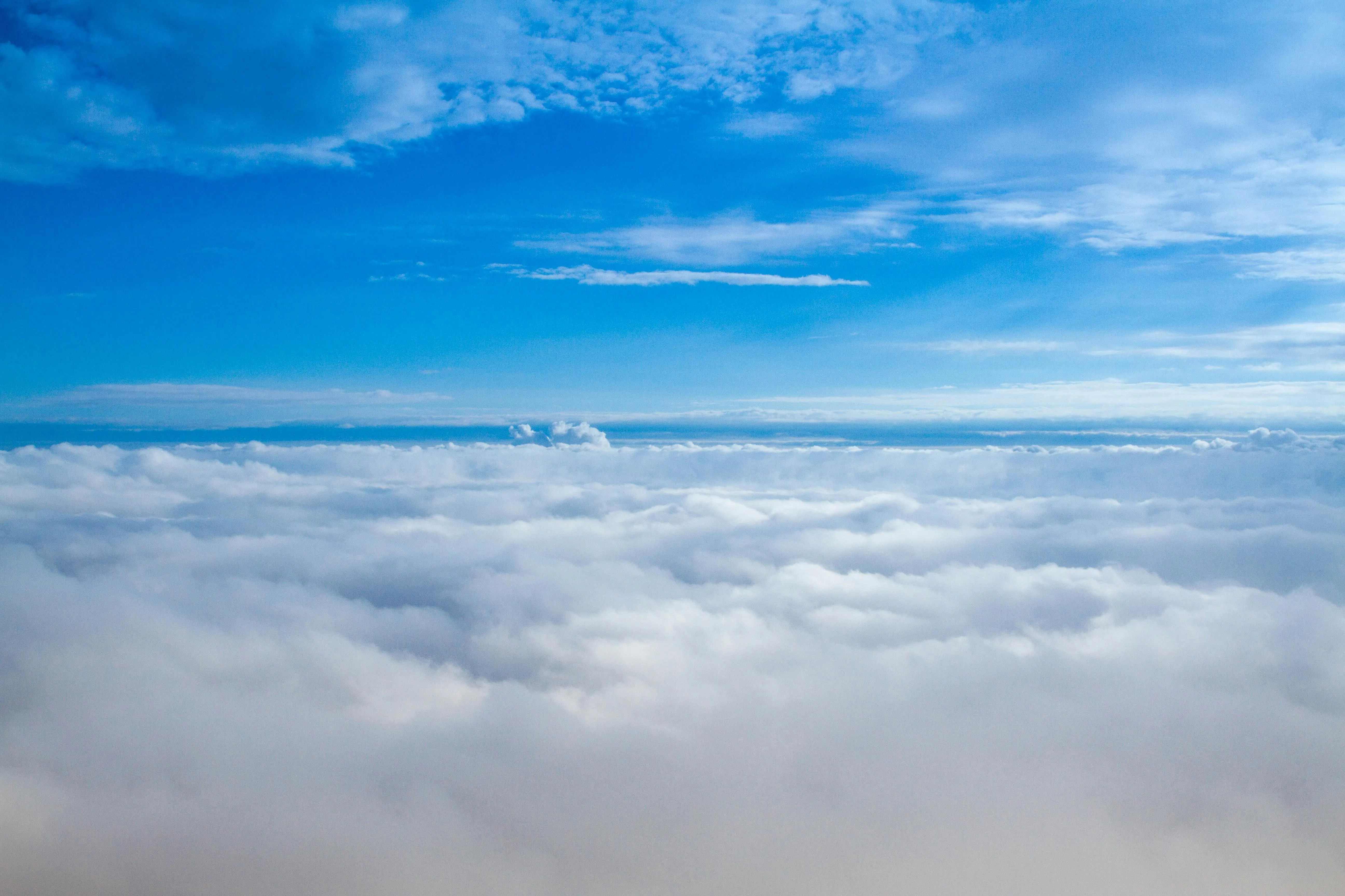 Blue sky and clouds seen from above in a peaceful setting