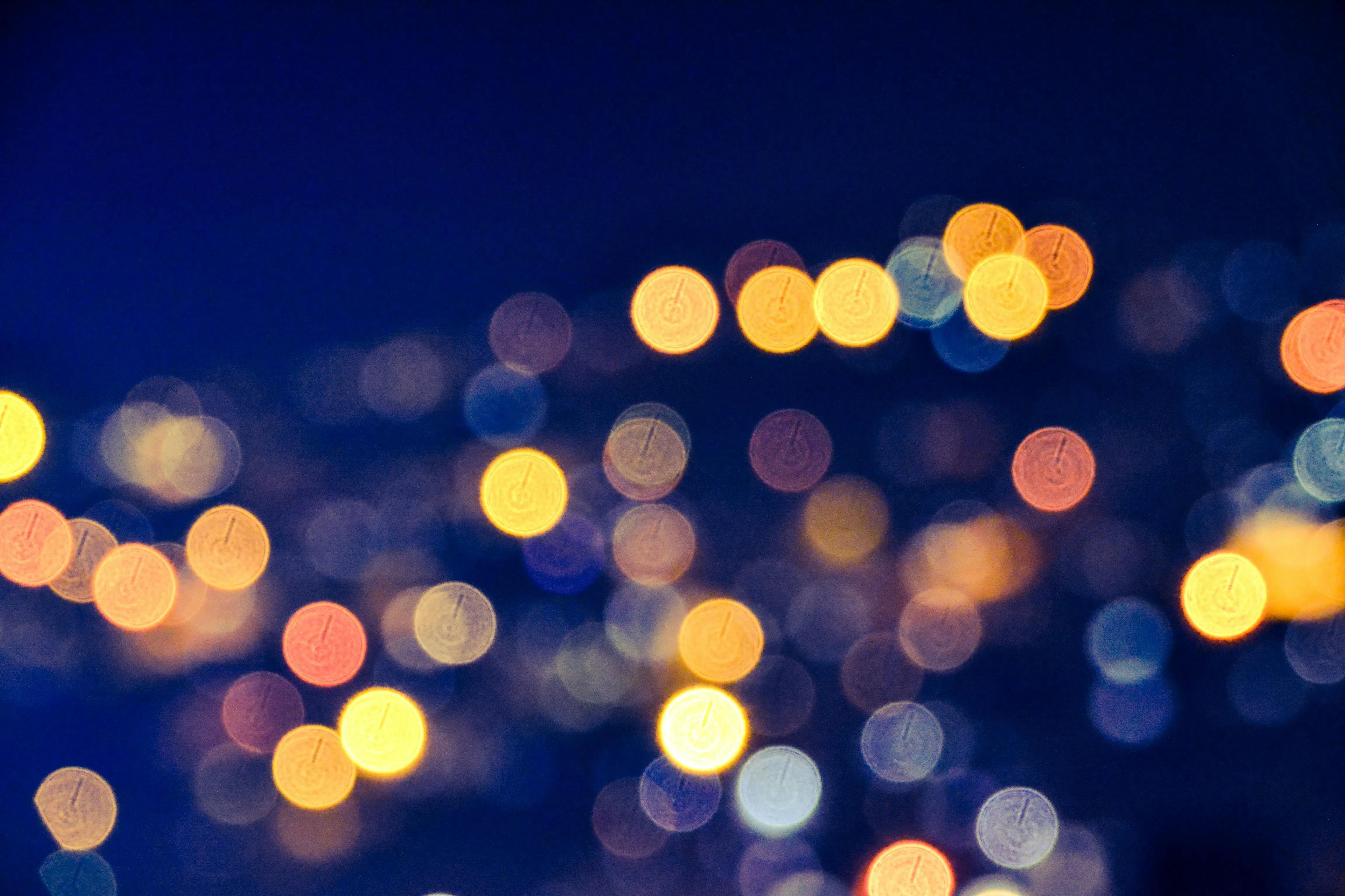 Blurred city lights with a beautiful bokeh effect at night