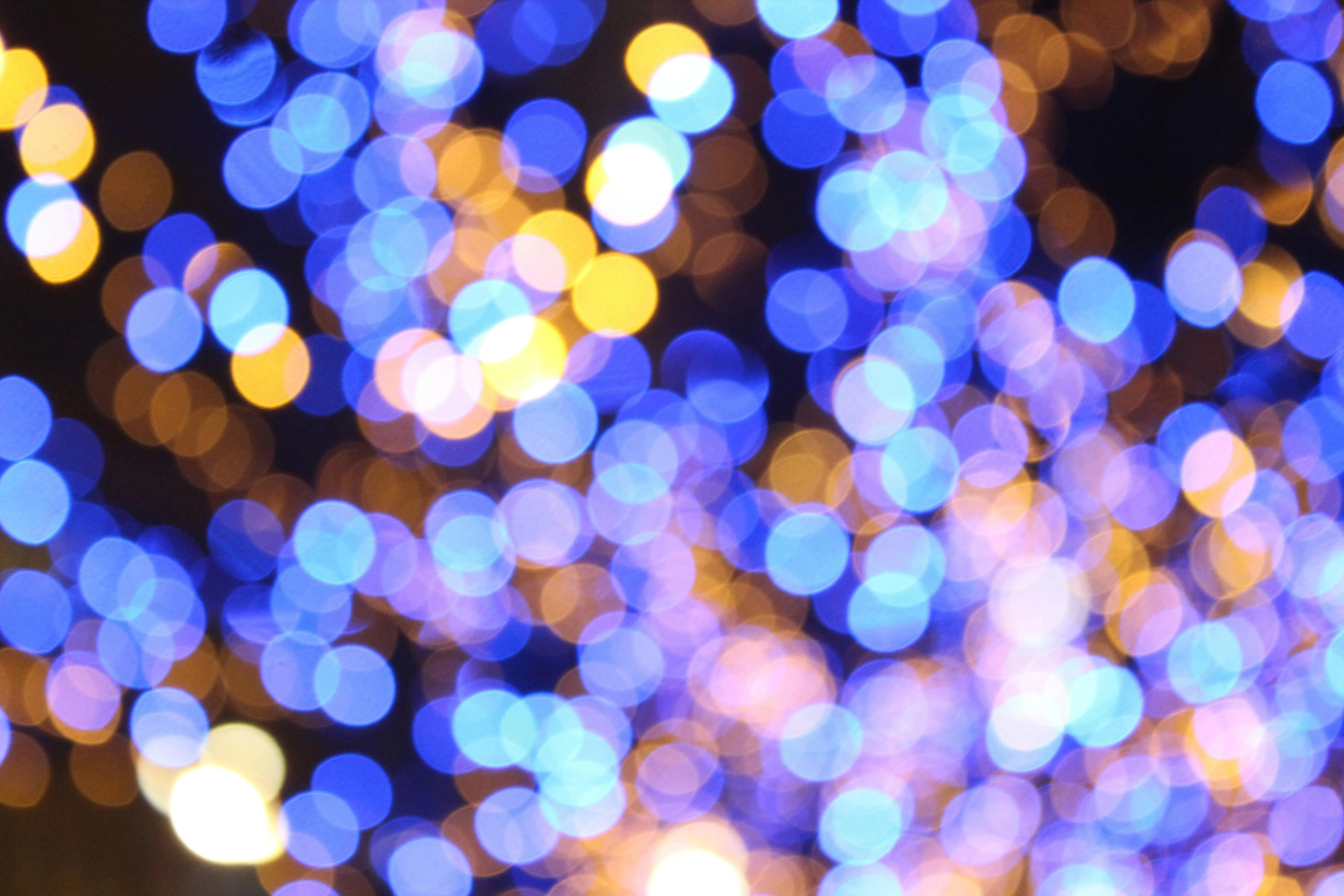 Blurred colourful blue and purple bokeh lights background