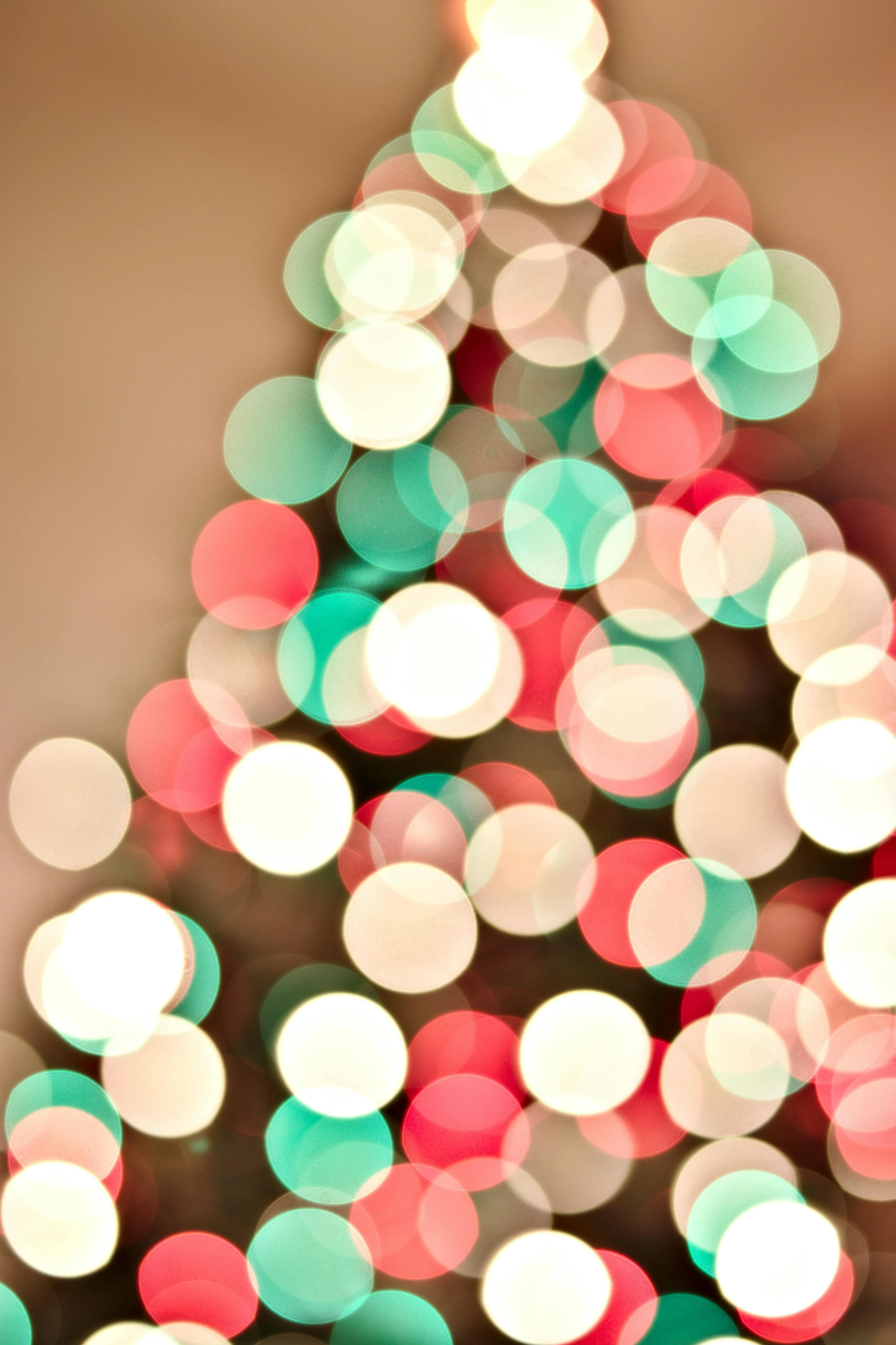 Blurred colourful Christmas lights bokeh with a tree shape