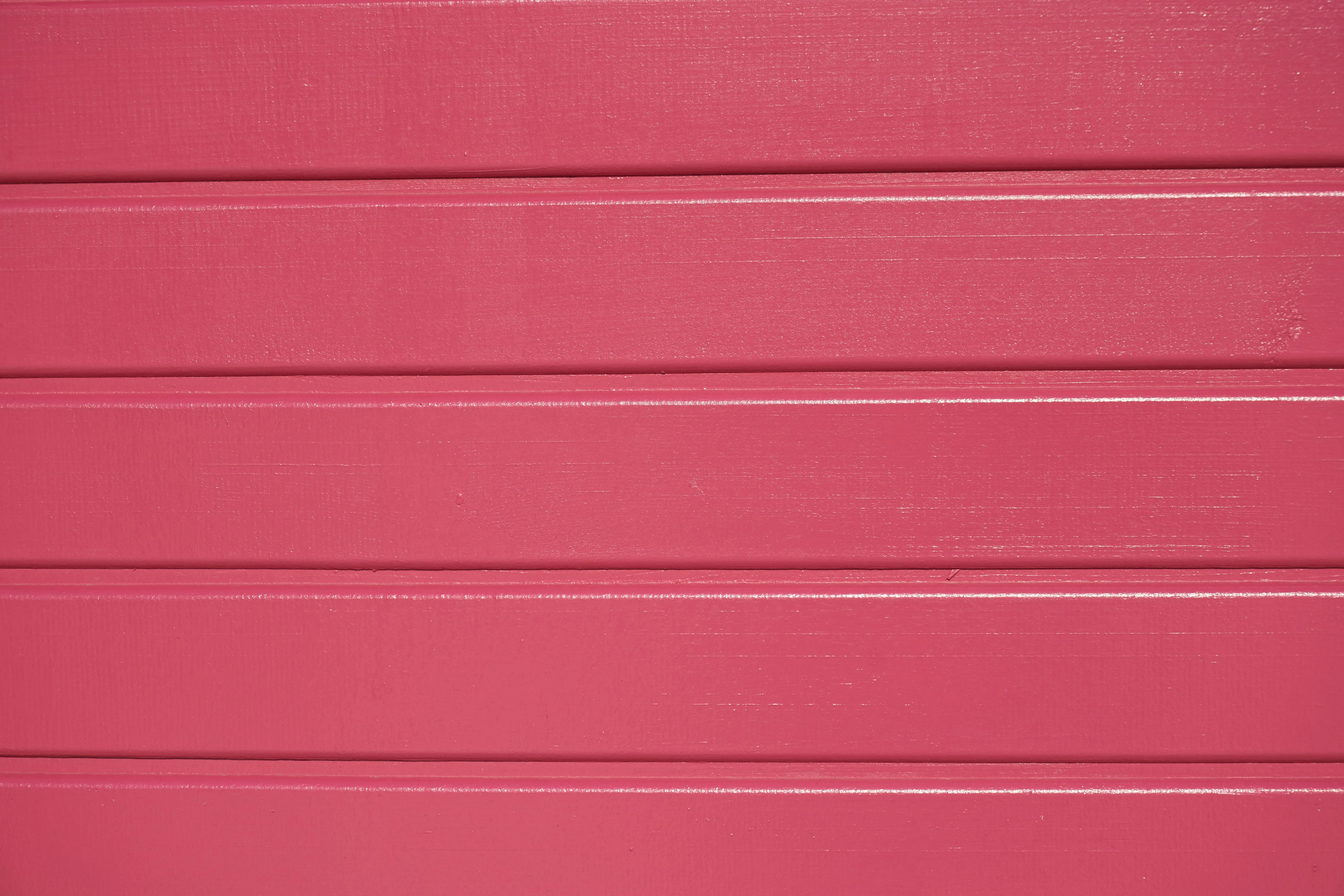 Bright pink painted wood board with horizontal lines image