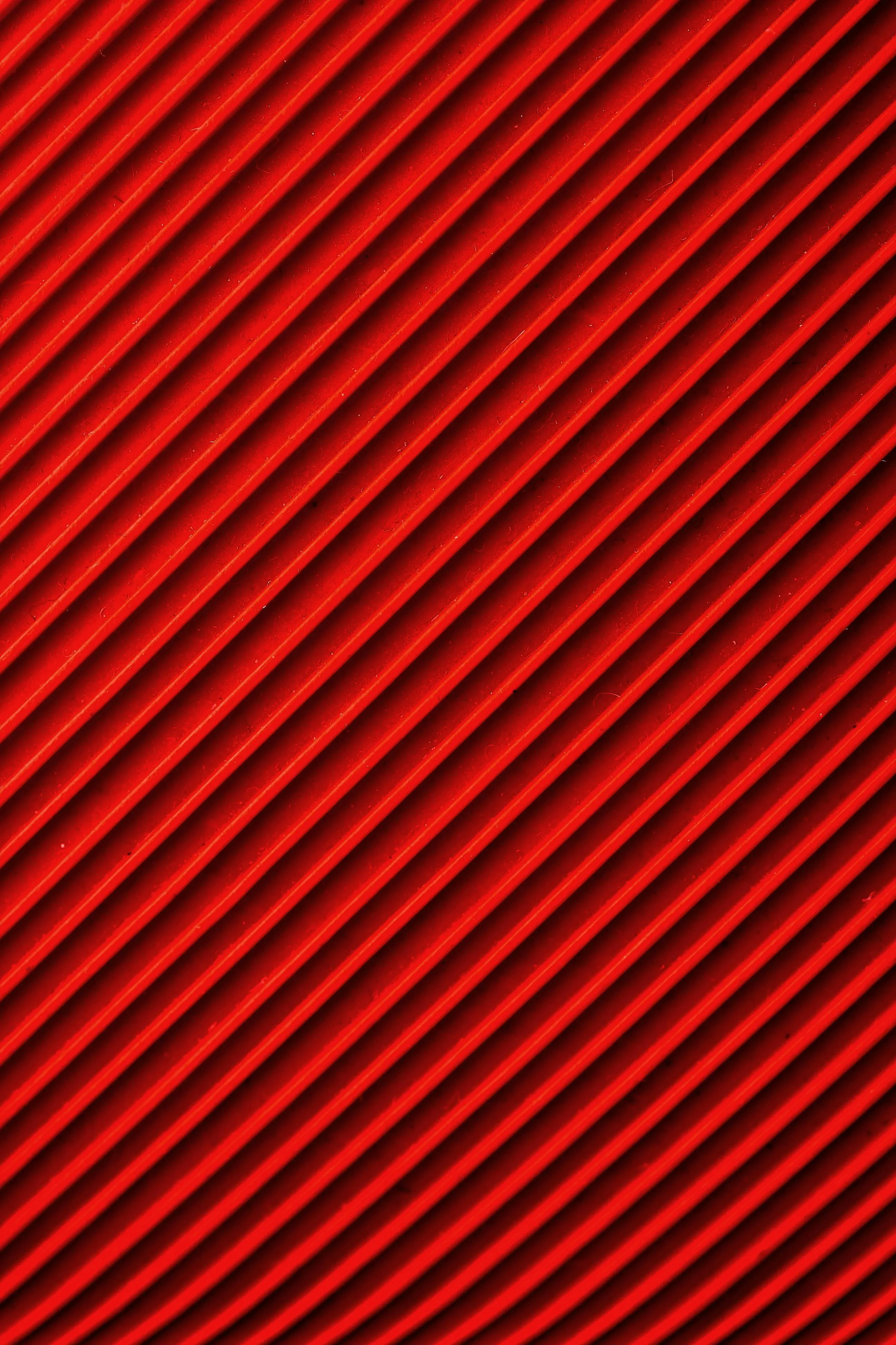 Bright red diagonal stripes in a vivid abstract design image