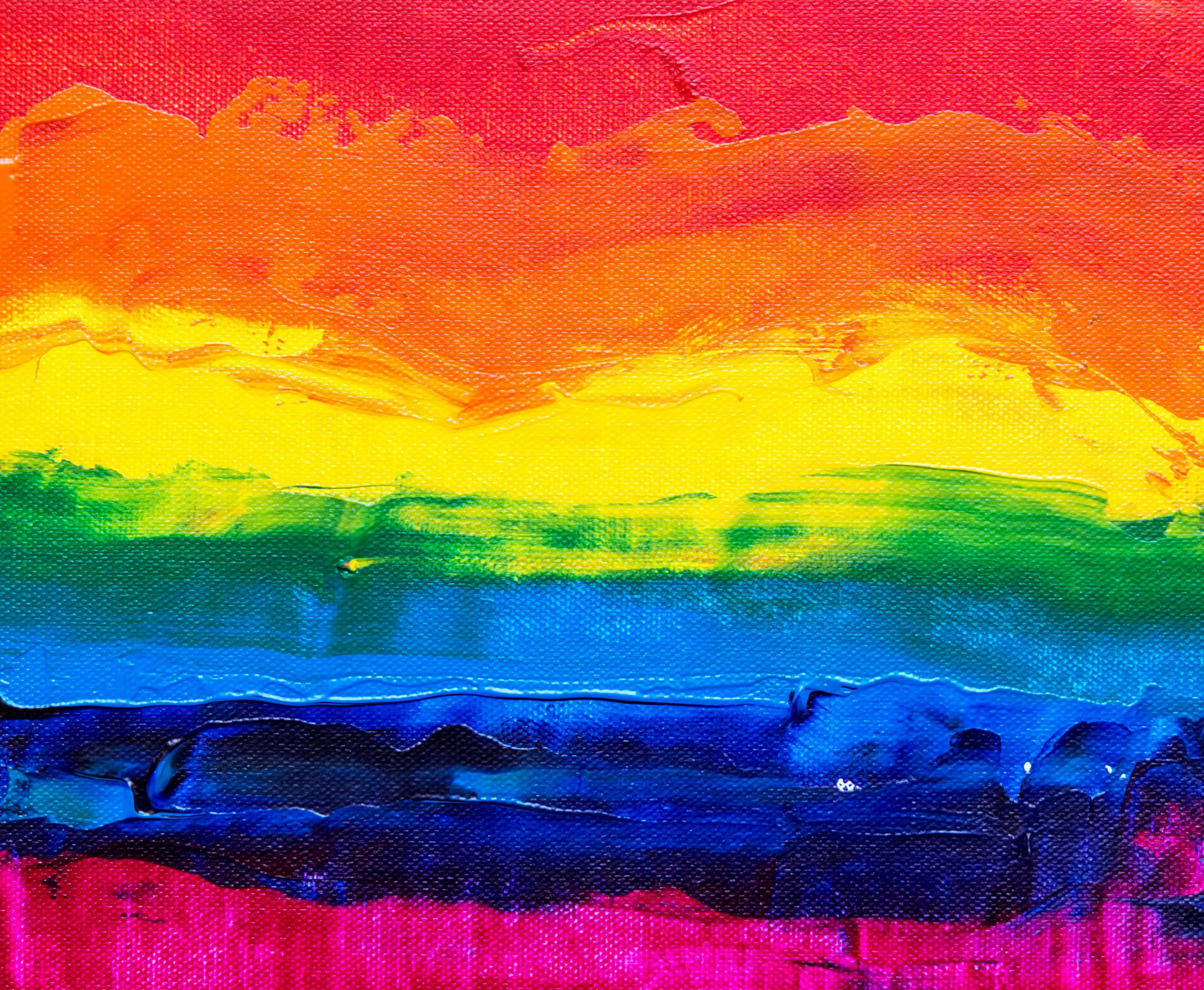 Bright vivid rainbow paint strokes blending smoothly 4K