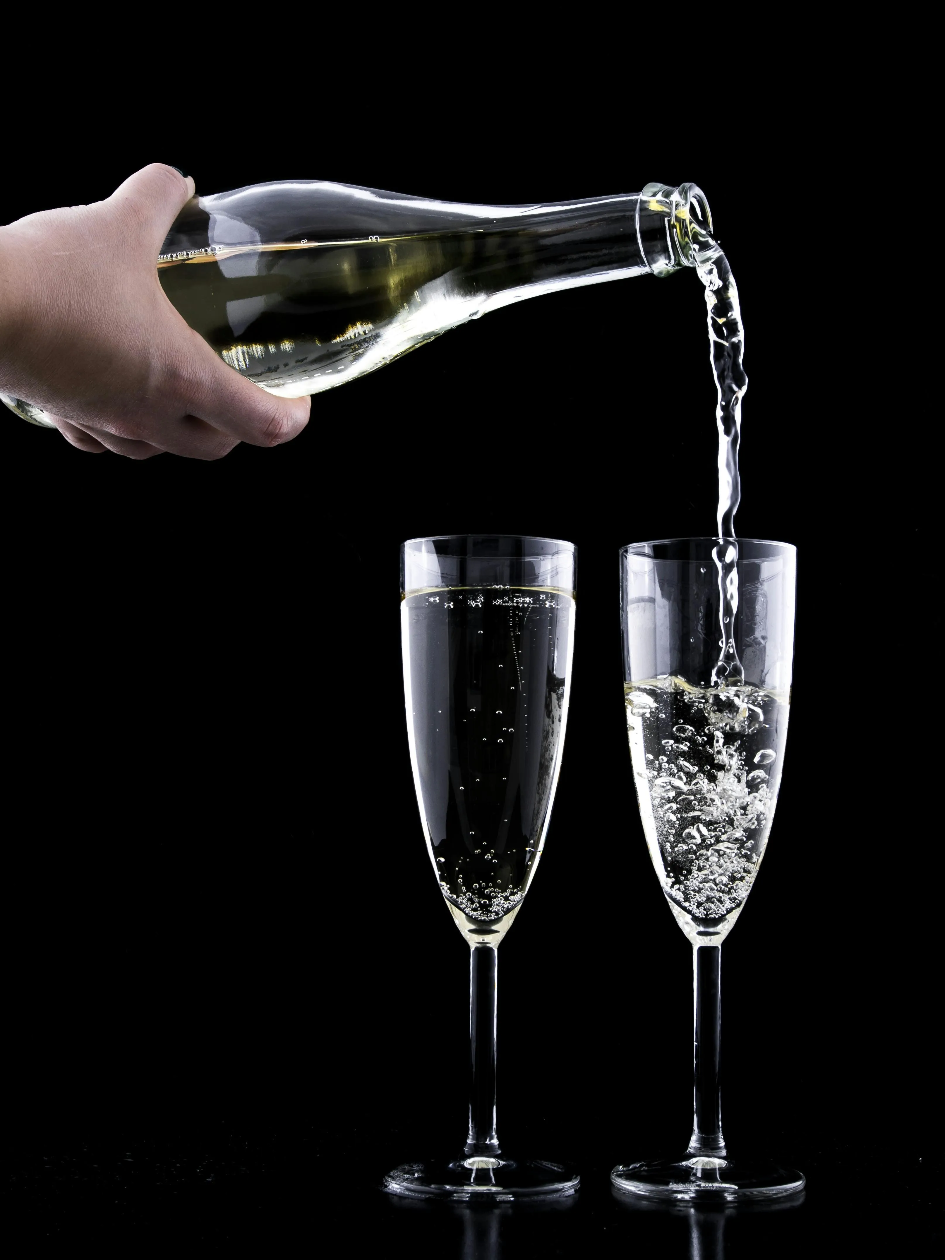 Champagne is being poured into glasses free HD Wallpaper