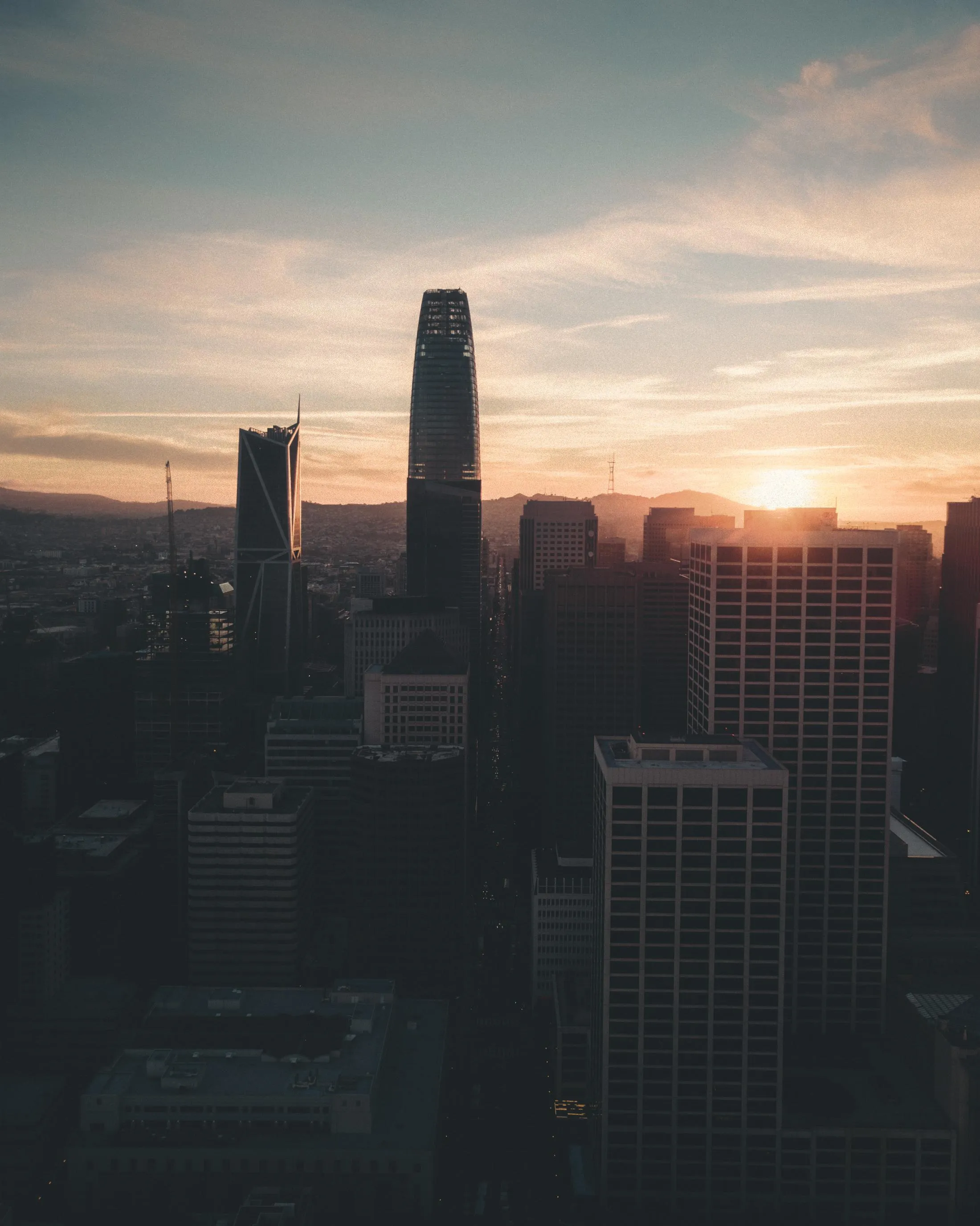 City Skyline During Sunset with Warm Evening Light Wallpaper