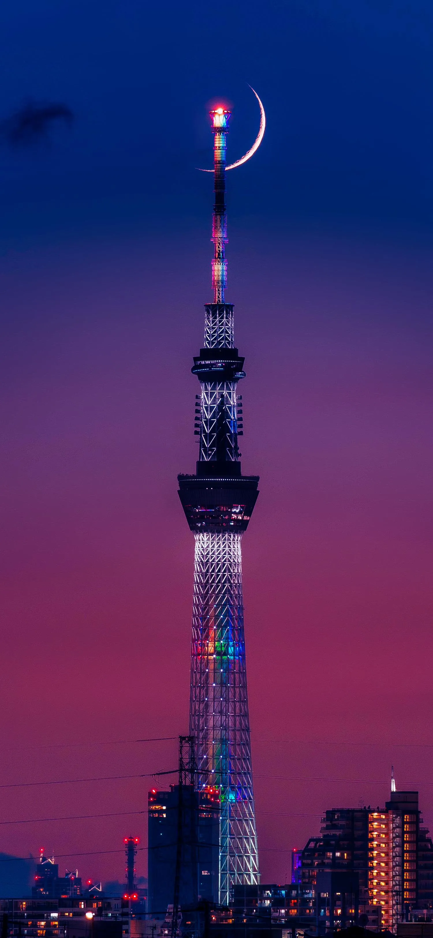 City Skyline with Tower and Moon in Evening Sky Wallpaper