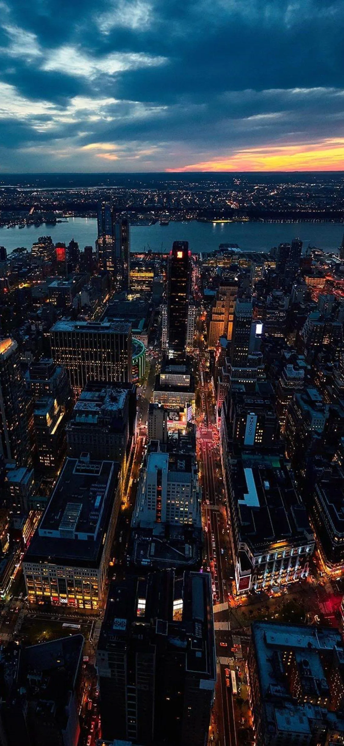 Cityscape at dusk with glowing buildings and skyline 4K
