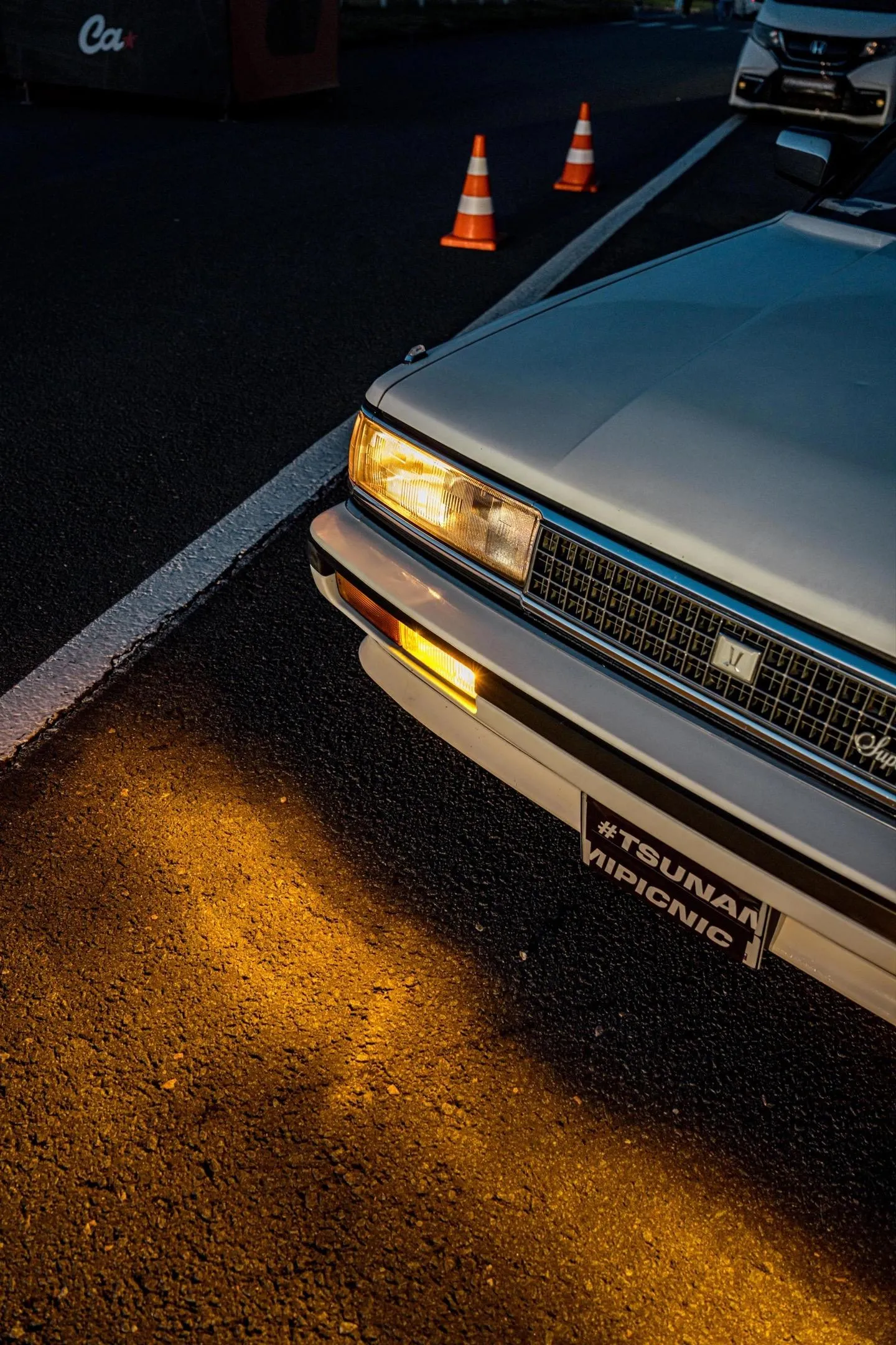 Classic Vintage Car with Warm Golden Lighting Wallpaper