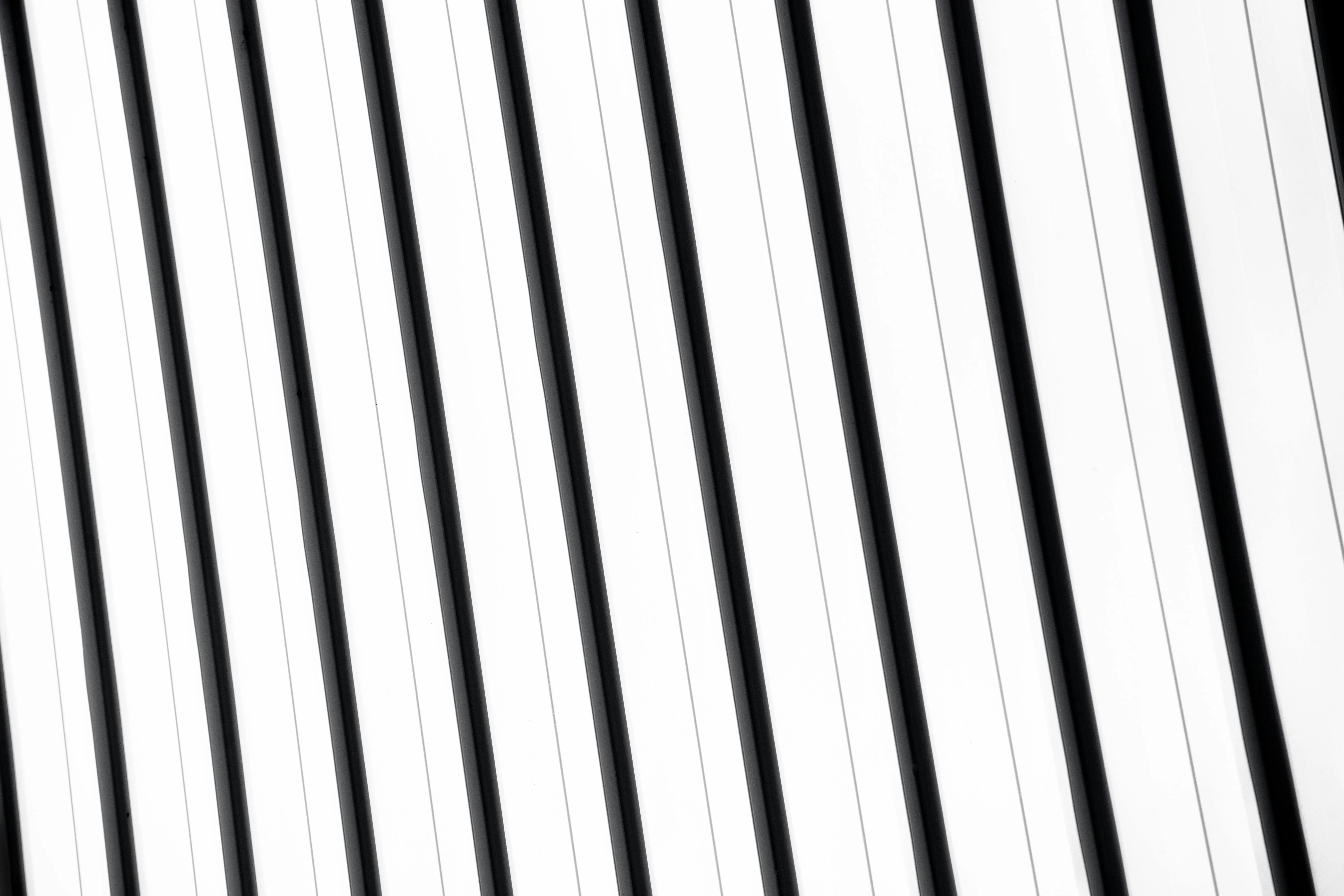 Clean white background with bold black diagonal lines image