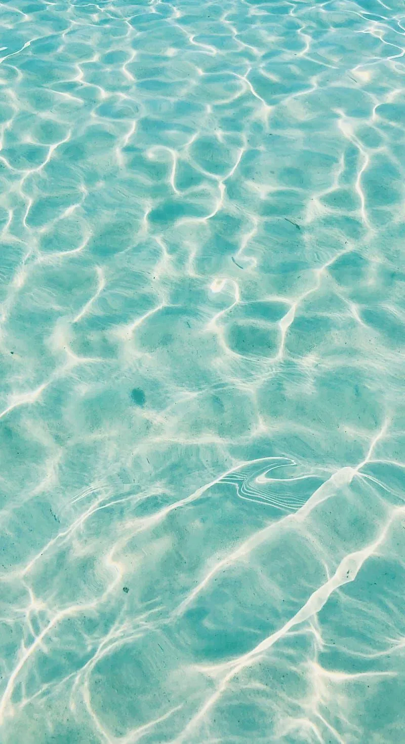 Clear Aqua pool water with light reflections free Wallpaper