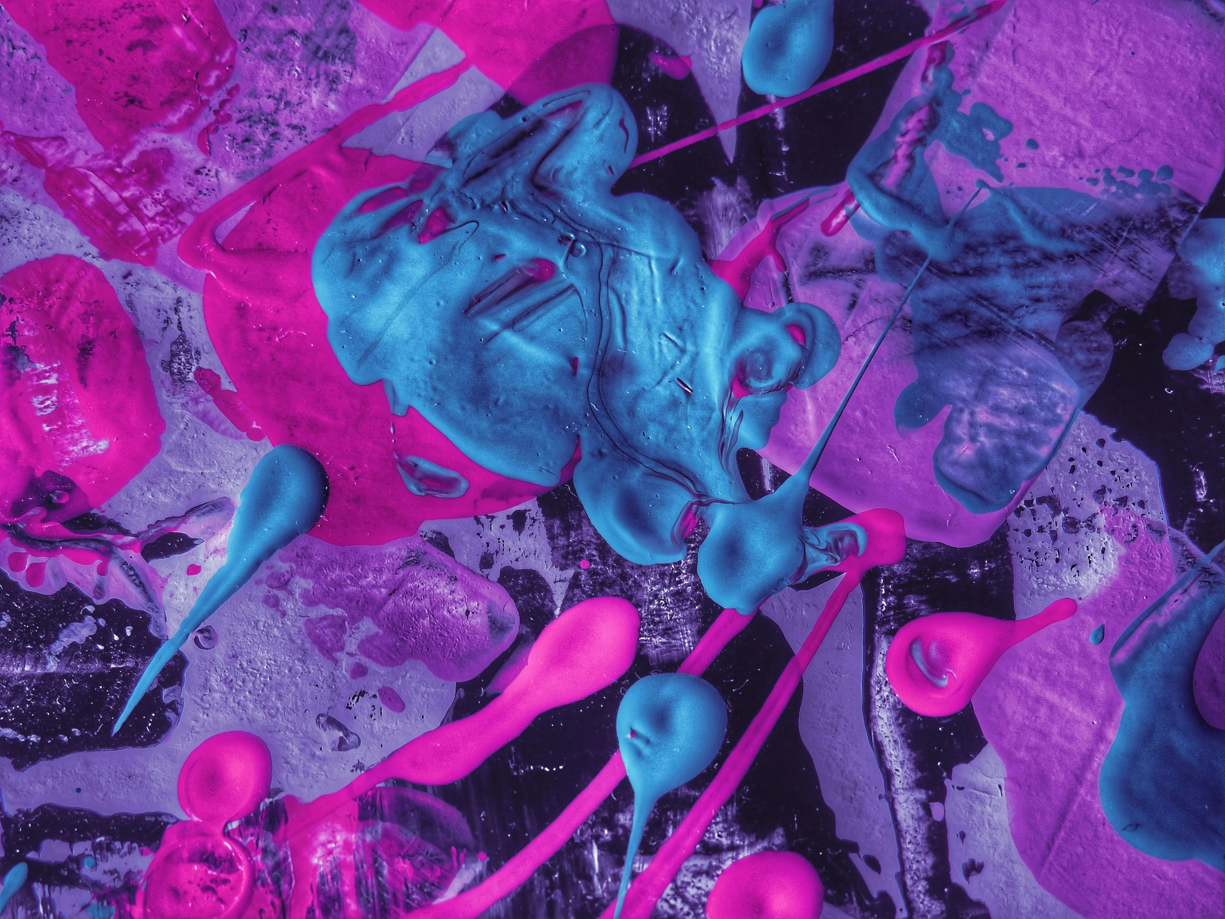 Close up of pink and blue paint splatter Background image