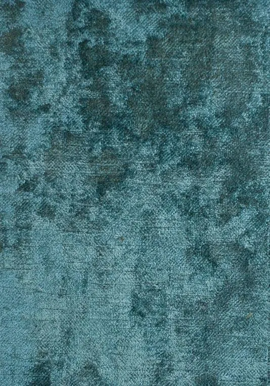 Close up of textured blue fabric with a soft velvet look