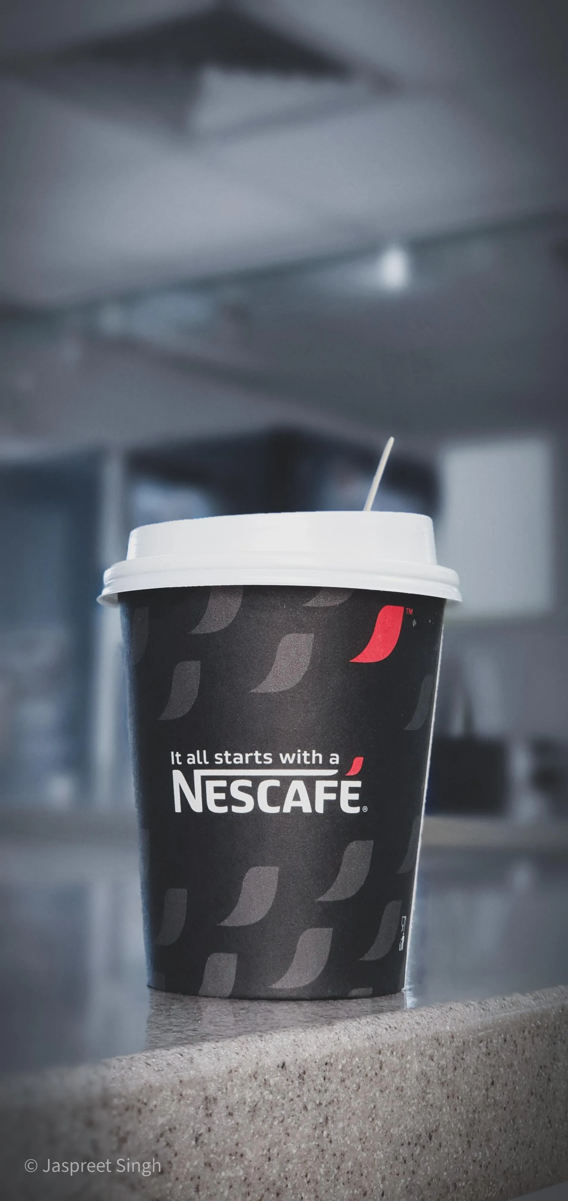 Coffee Cup with Steam in Minimalist Setting Wallpaper