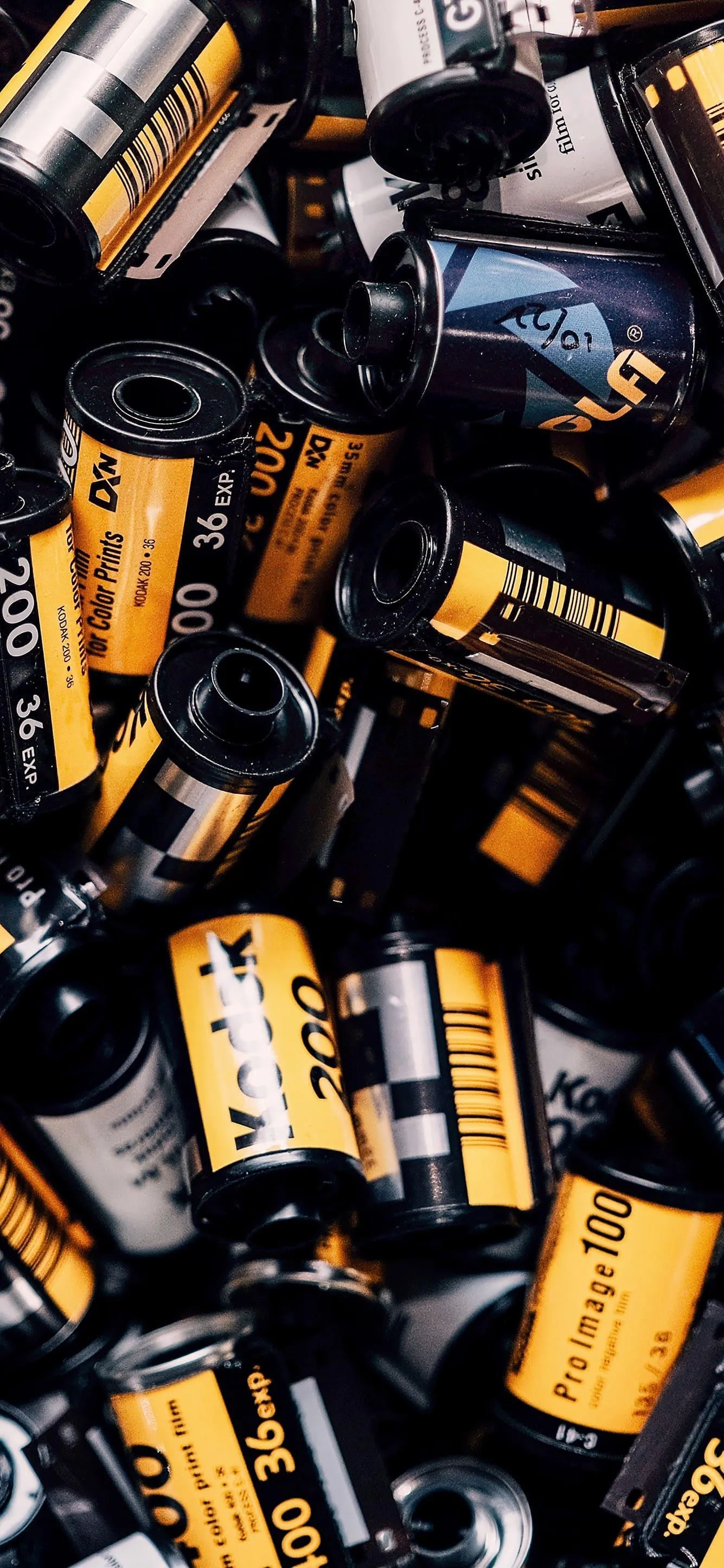 Collection of Black and Gold Camera Film Rolls HD image