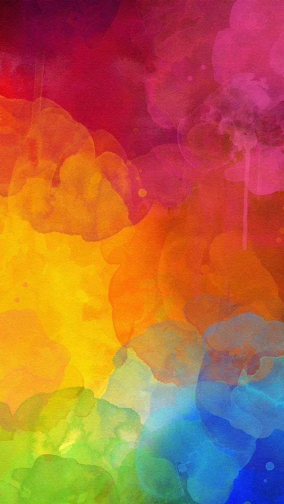 Colourful abstract smoke blends with bright rainbow tones