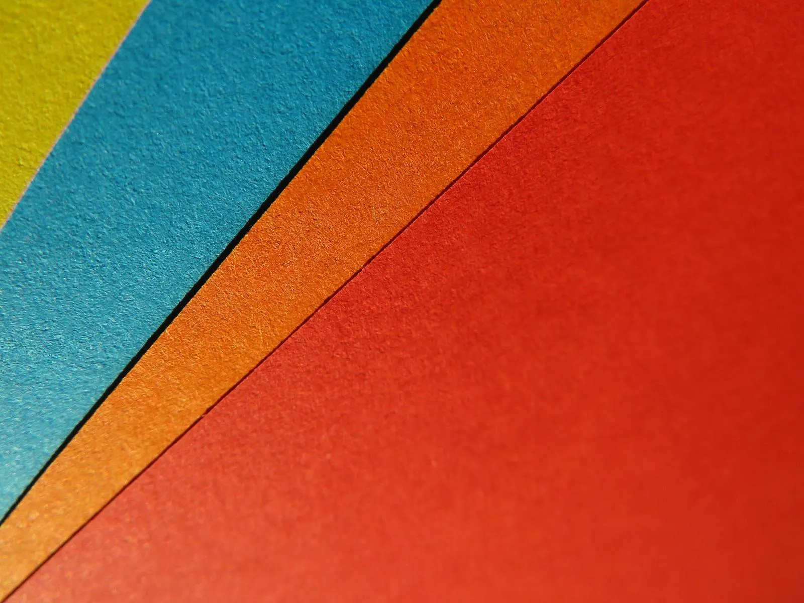 Colourful felt sheets layered together in a neat stack image