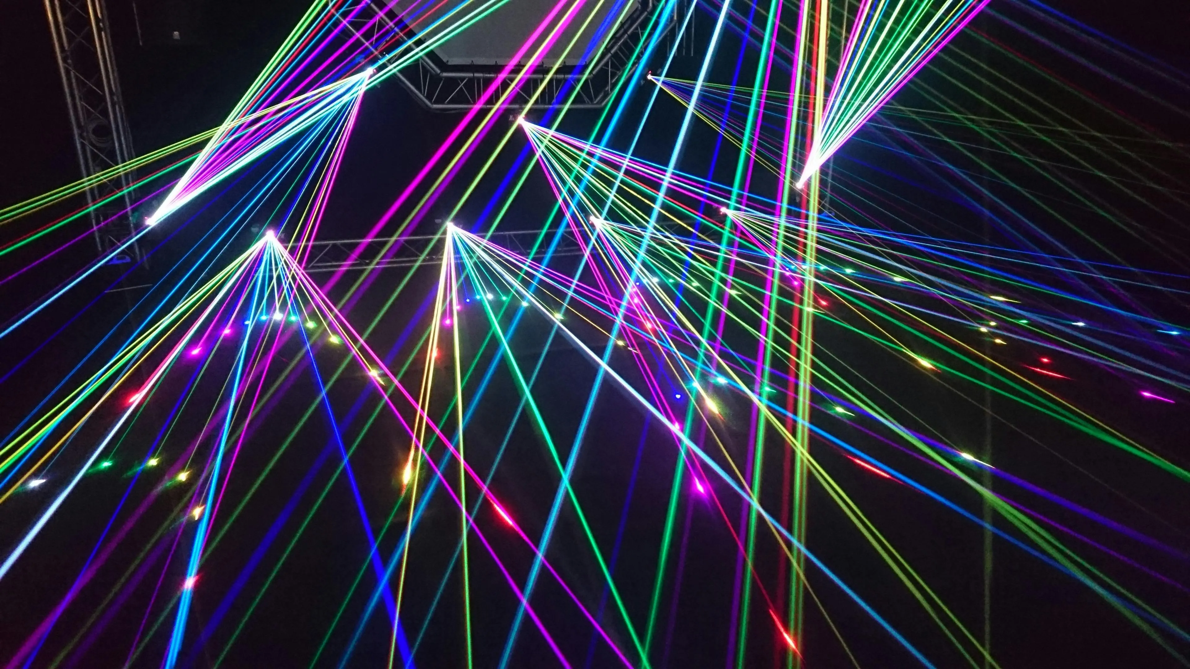 Colourful neon laser light show on a black background HD