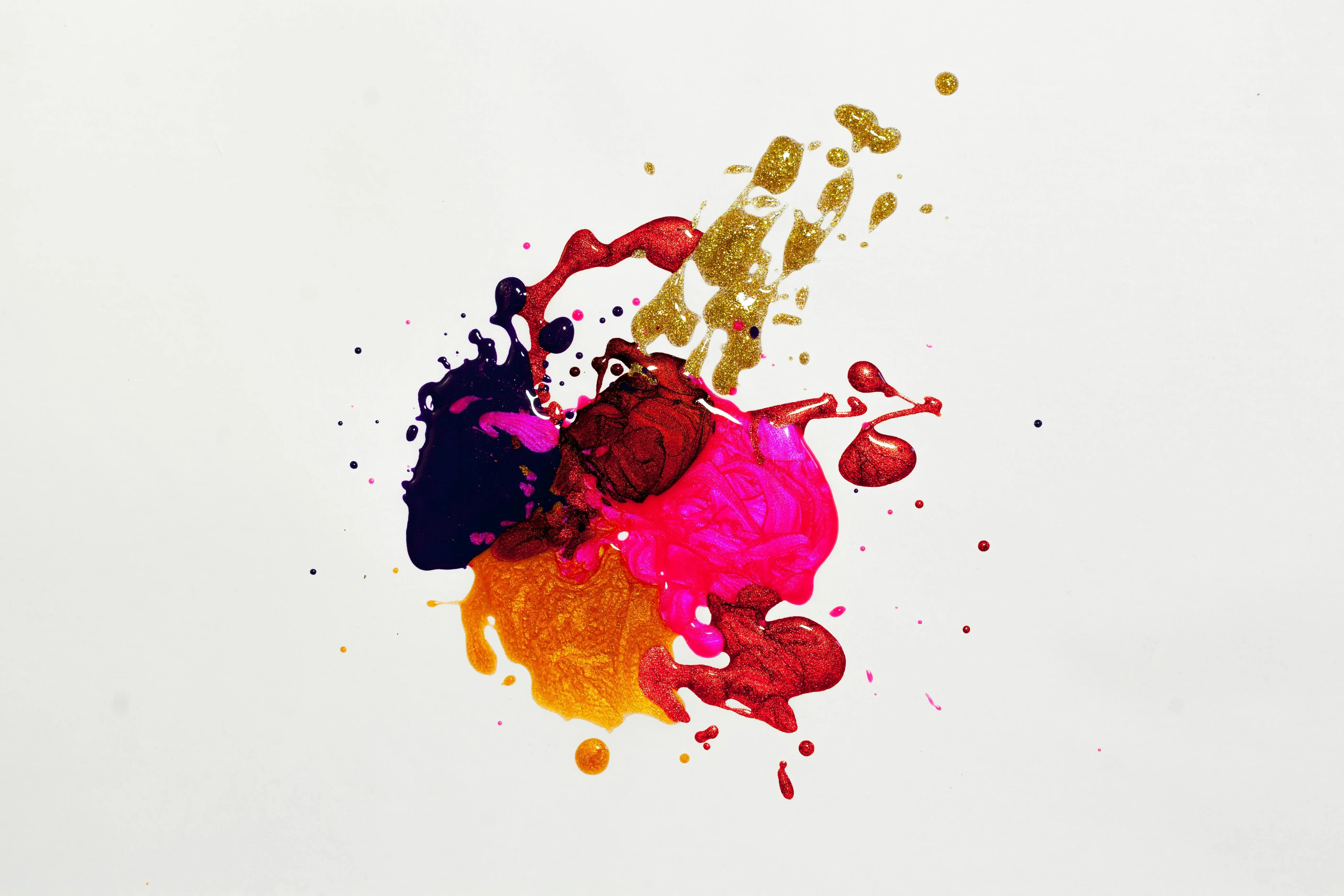 Colourful paint splashes on a white background Wallpaper