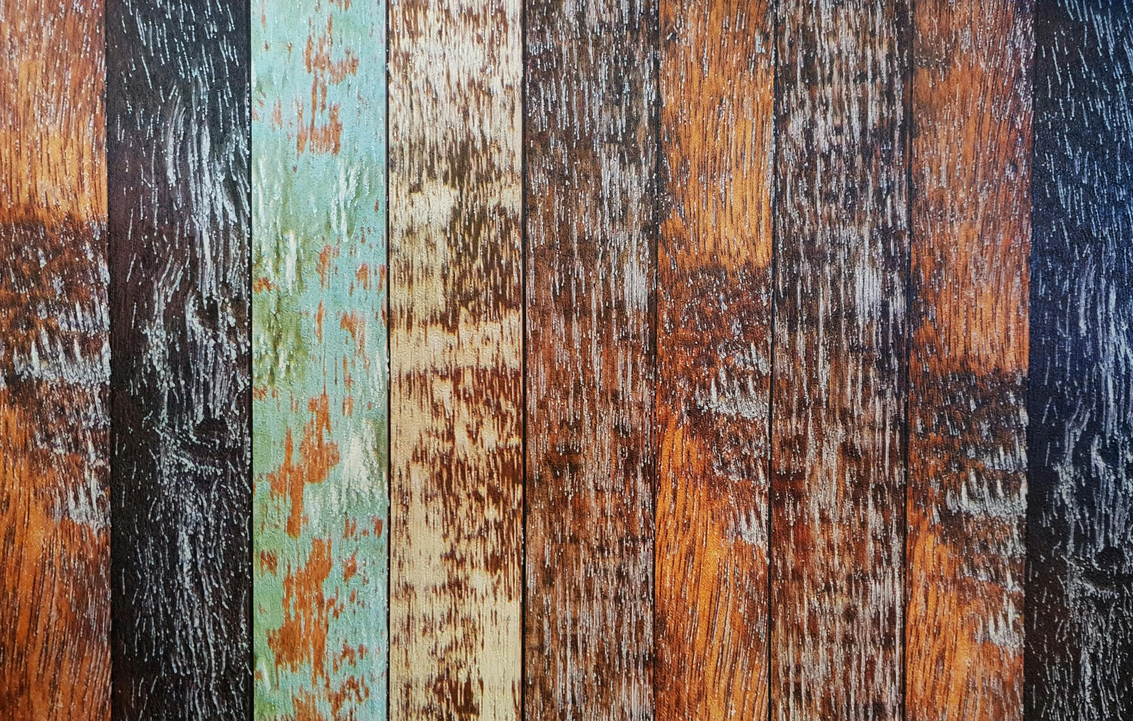 Colourful vintage wood slab with a rustic texture Wallpaper