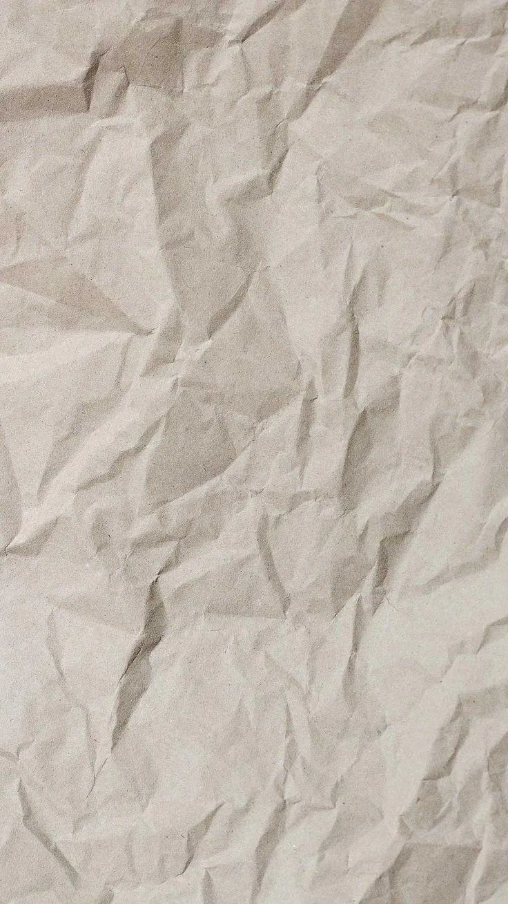 Crumpled white paper with natural wrinkles and shadows image