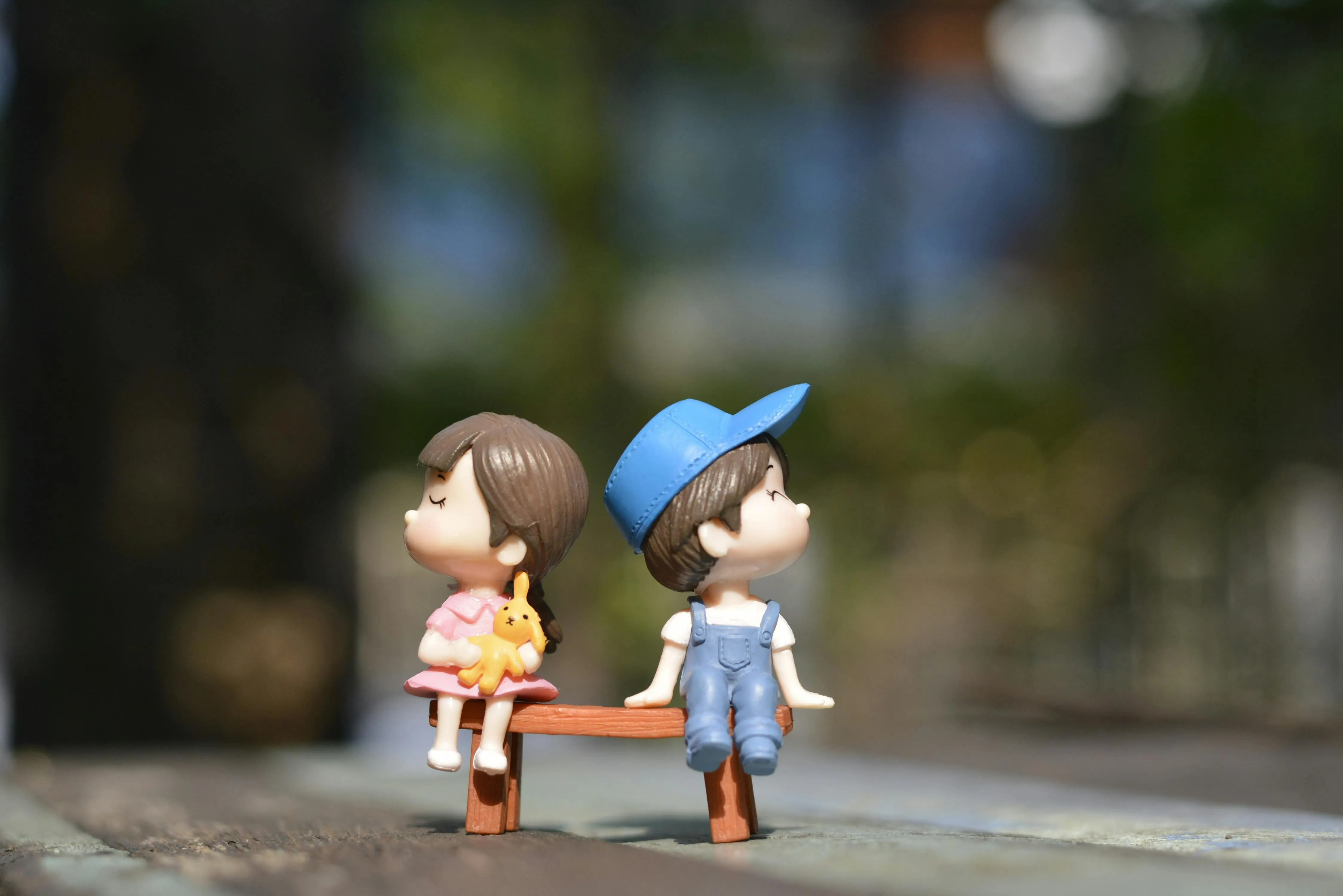 Cute two kids sitting on a bench at night free HD Wallpaper
