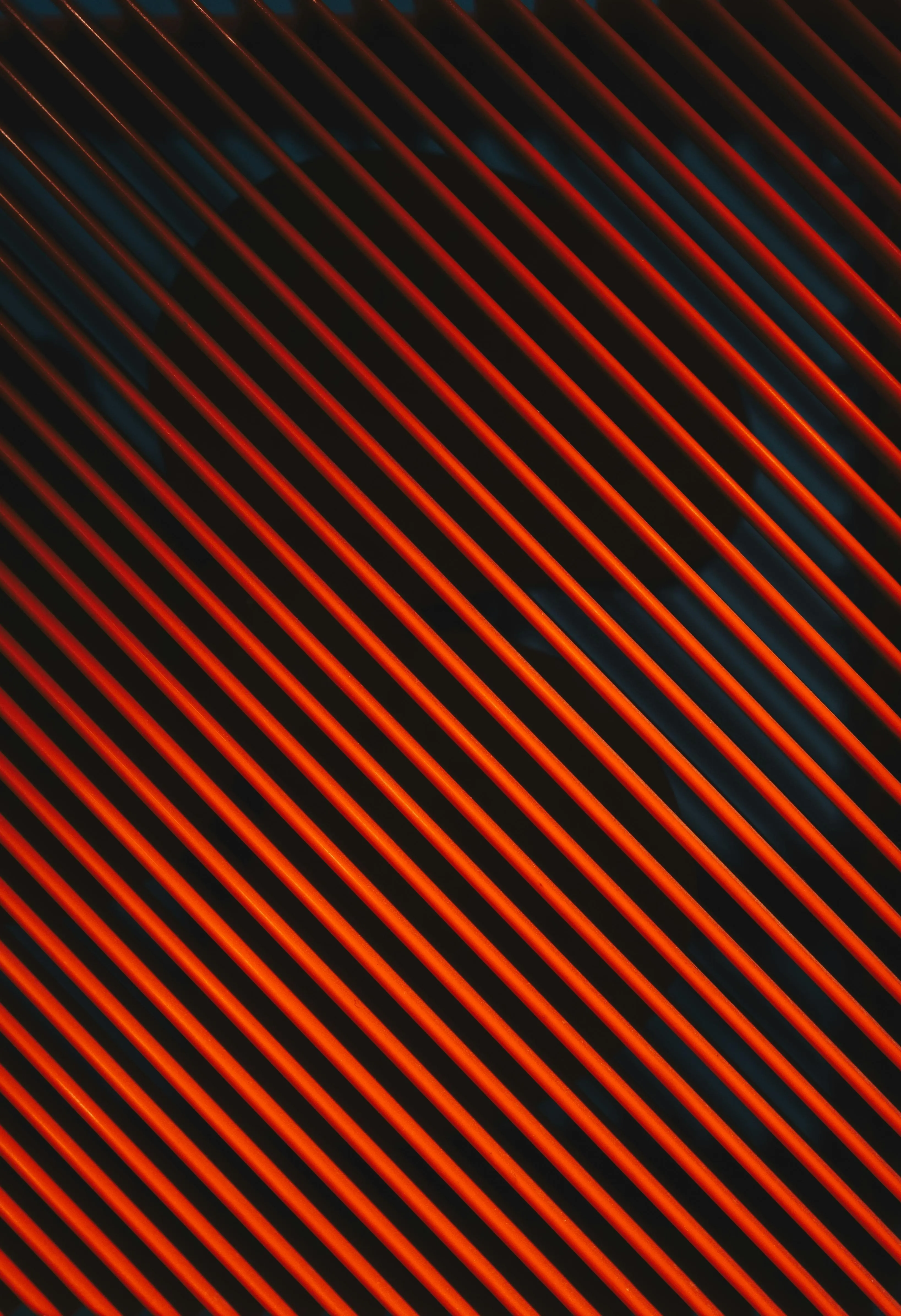 Dark background with glowing orange diagonal stripes image