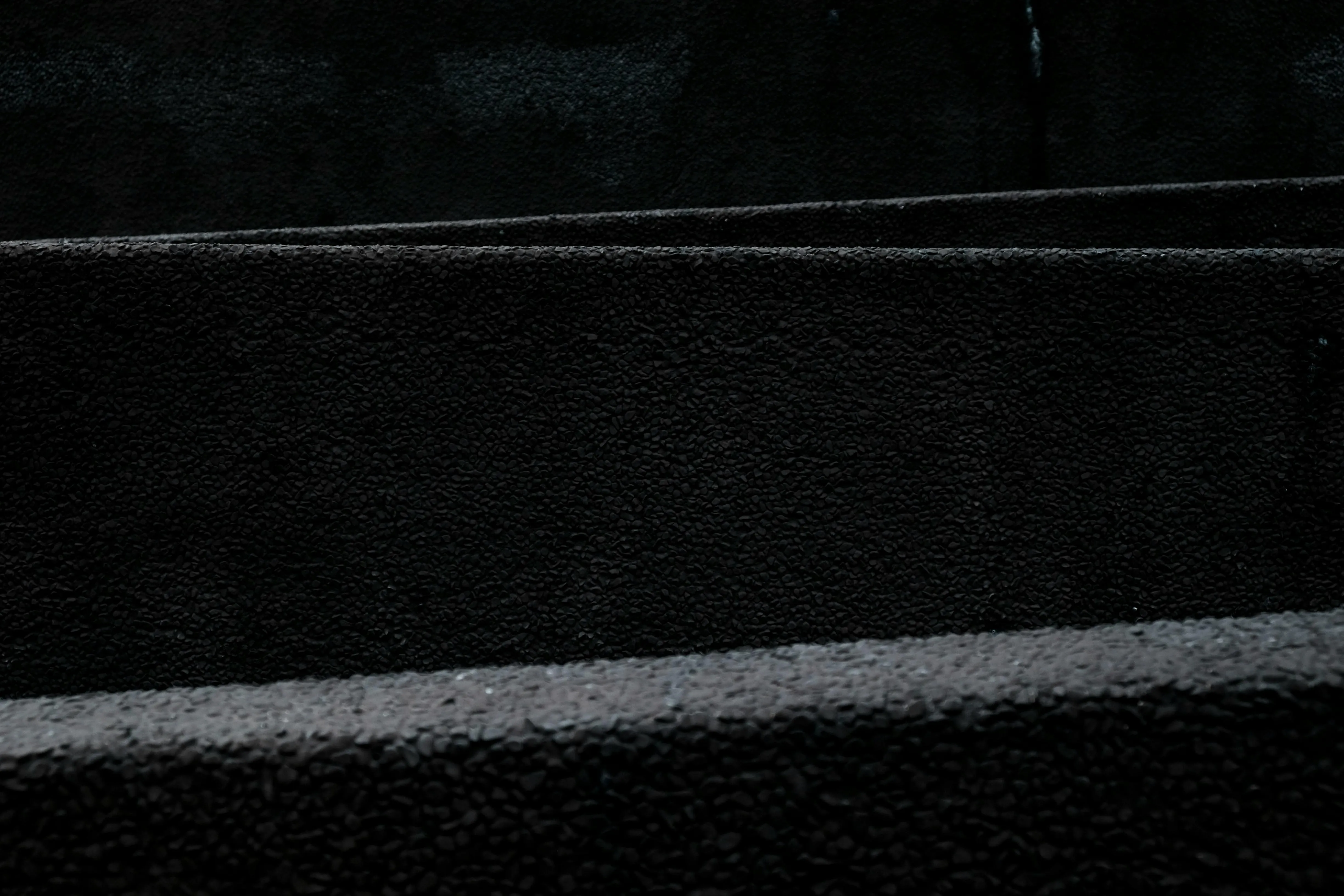 Dark black stairs with a shiny wet surface and lines image