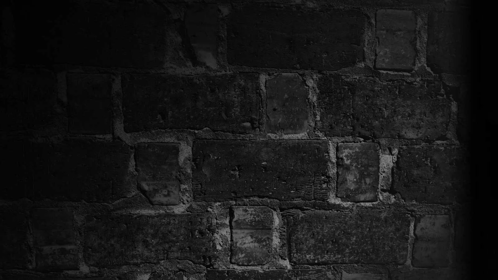 Dark brick wall background with a shadow lighting Wallpaper