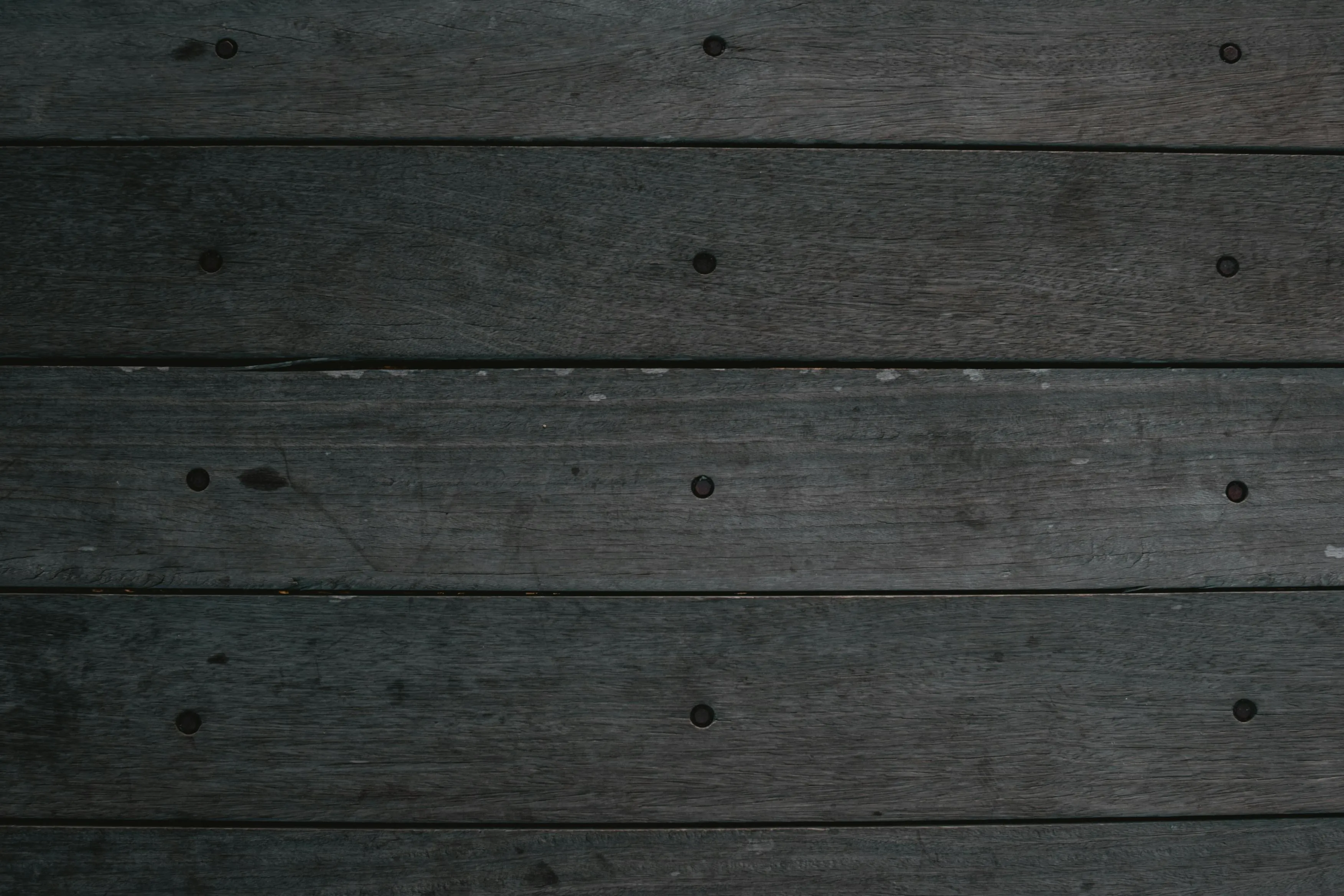 Dark gray wooden board surface with rustic texture image