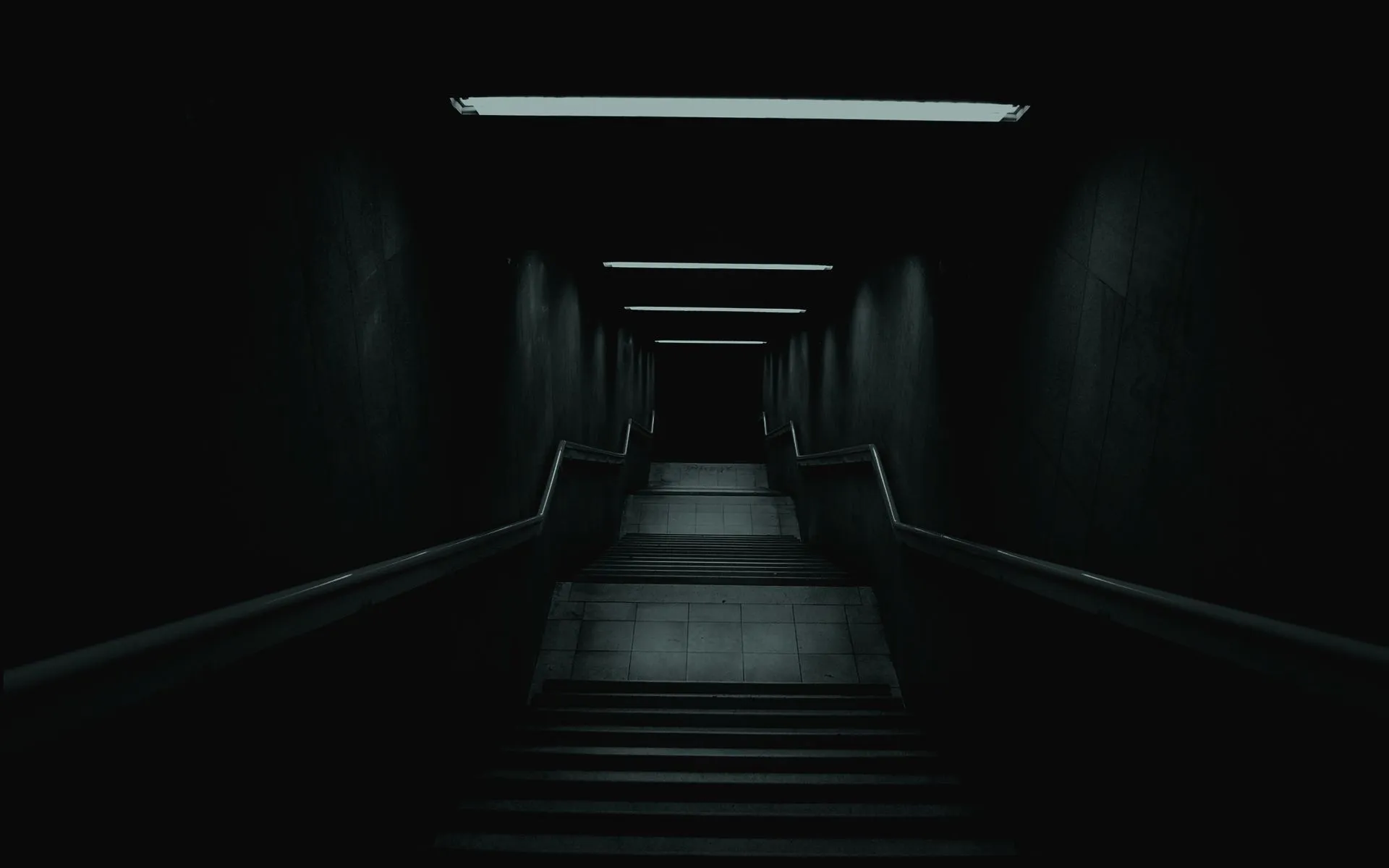 Dark mysterious hallway with overhead lighting background