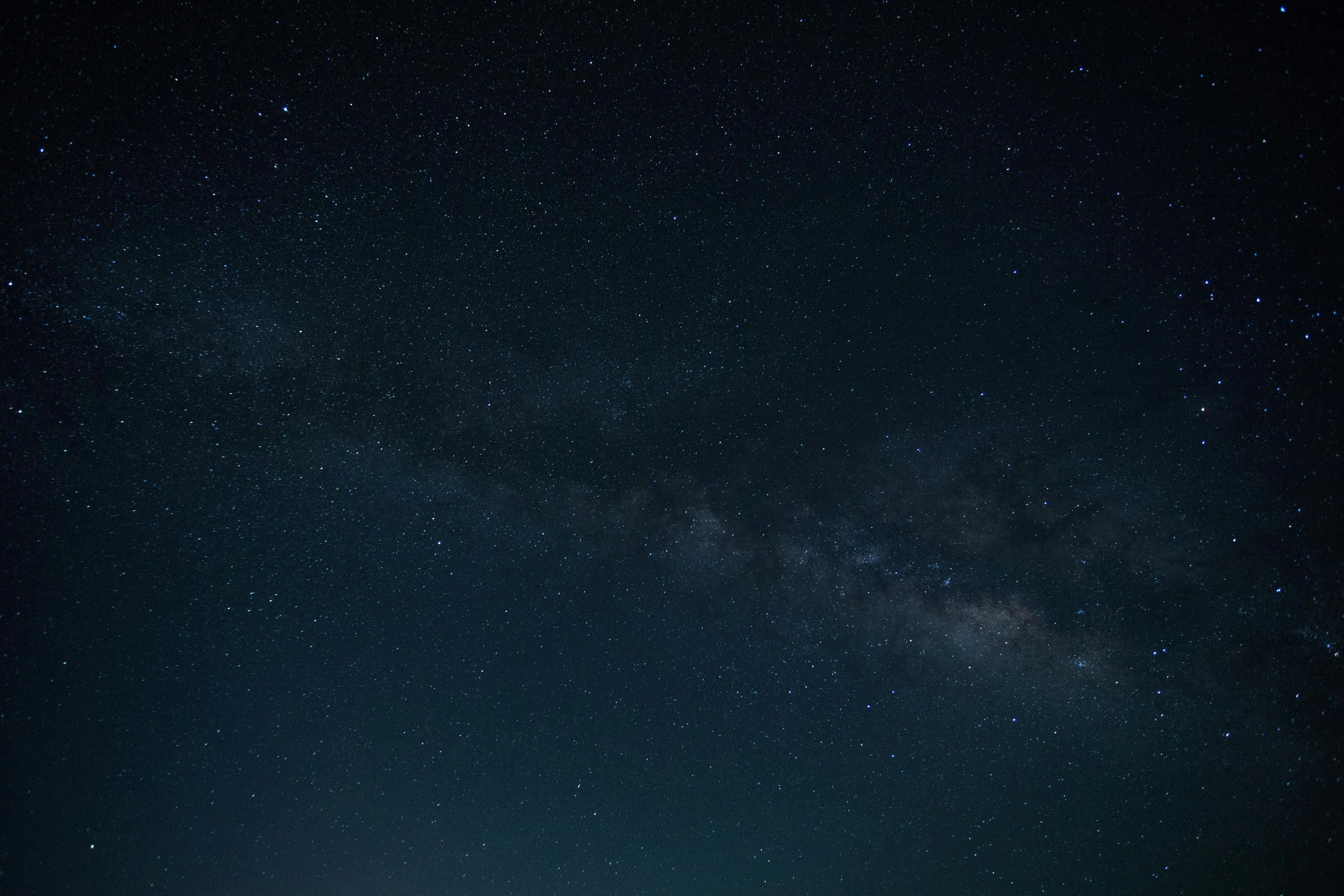 Dark night sky with visible Milky Way galaxy Background