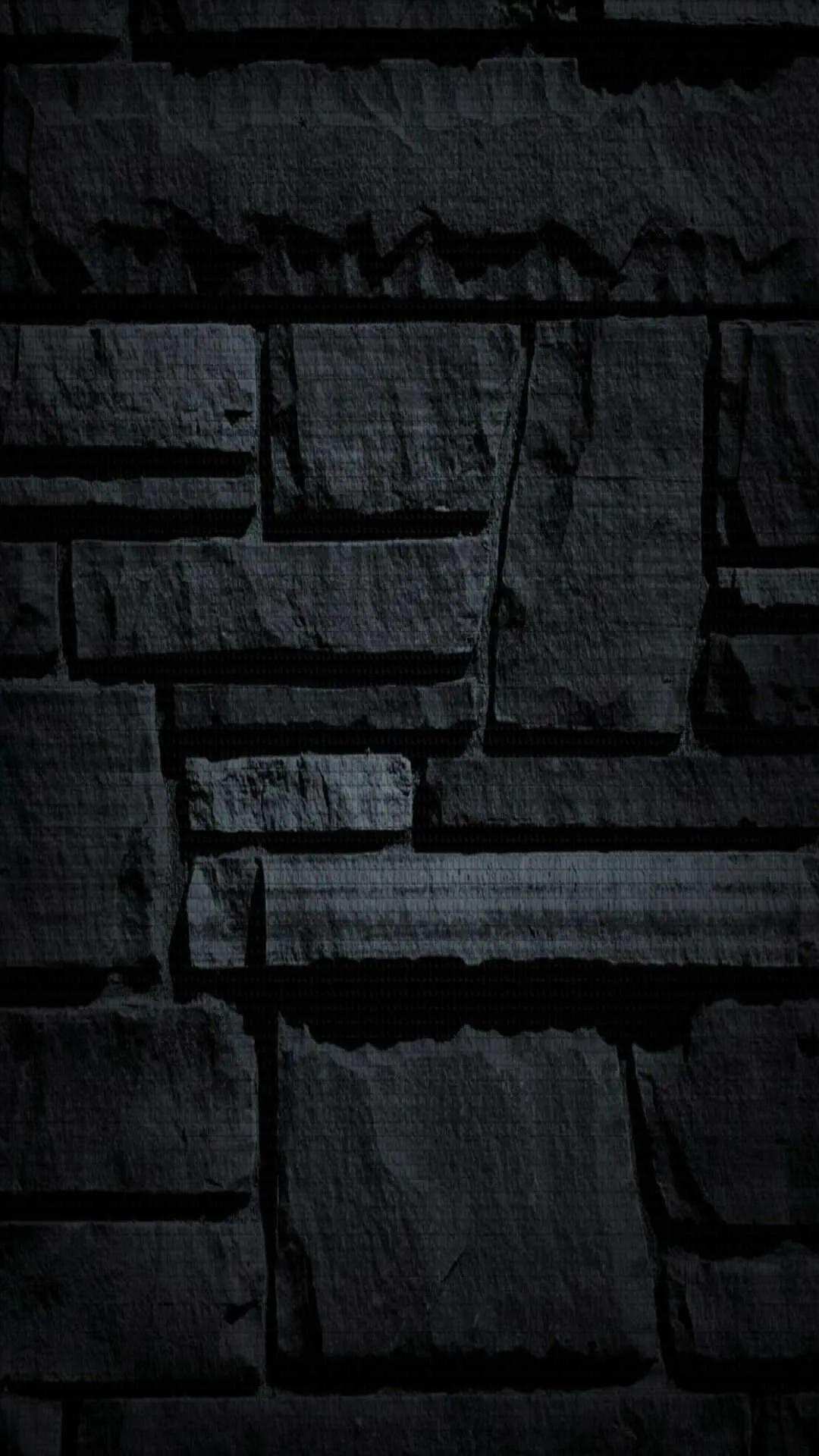 Dark stone wall texture with minimal lighting shadows image