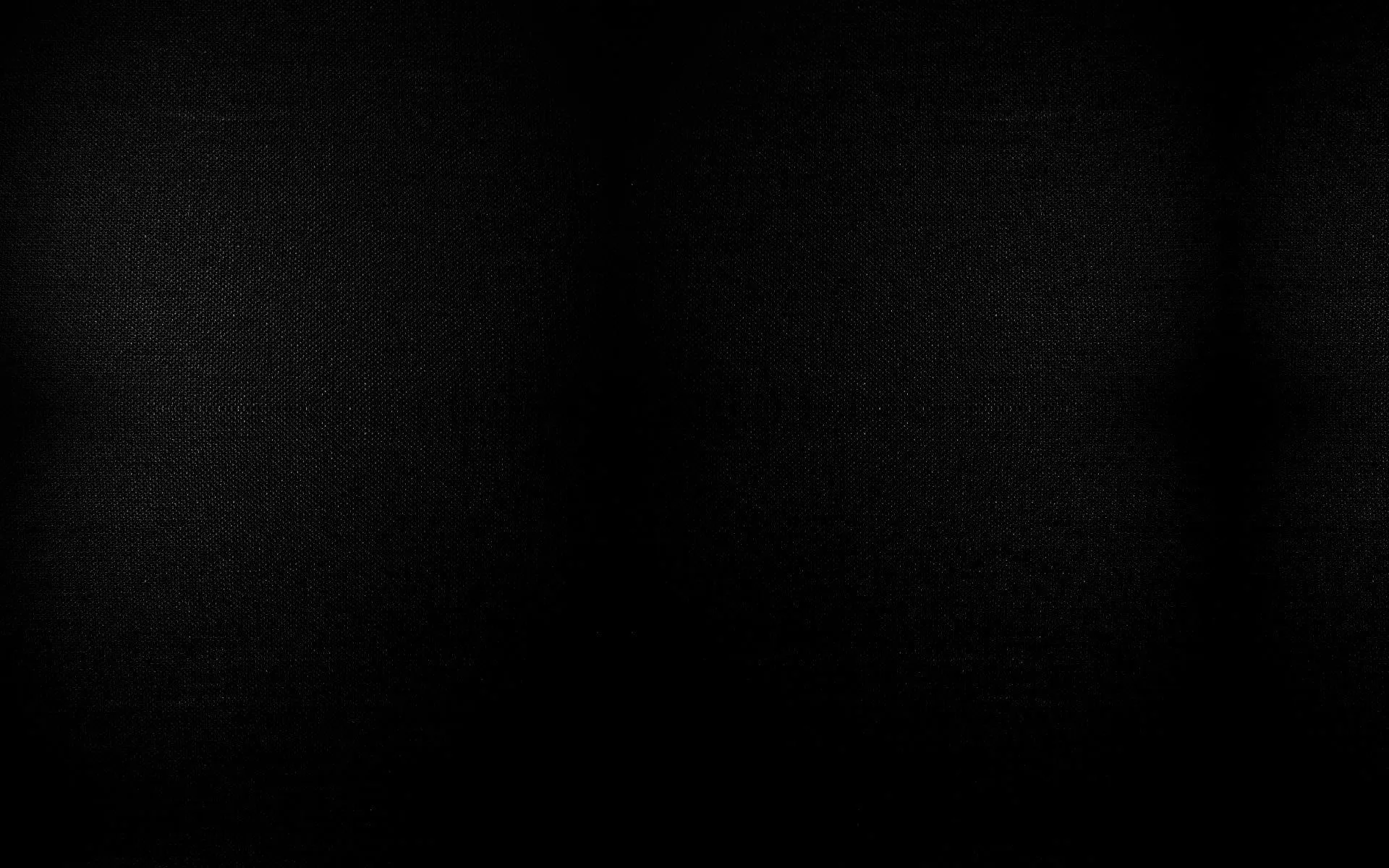 Dark textured background with soft light gradients Wallpaper