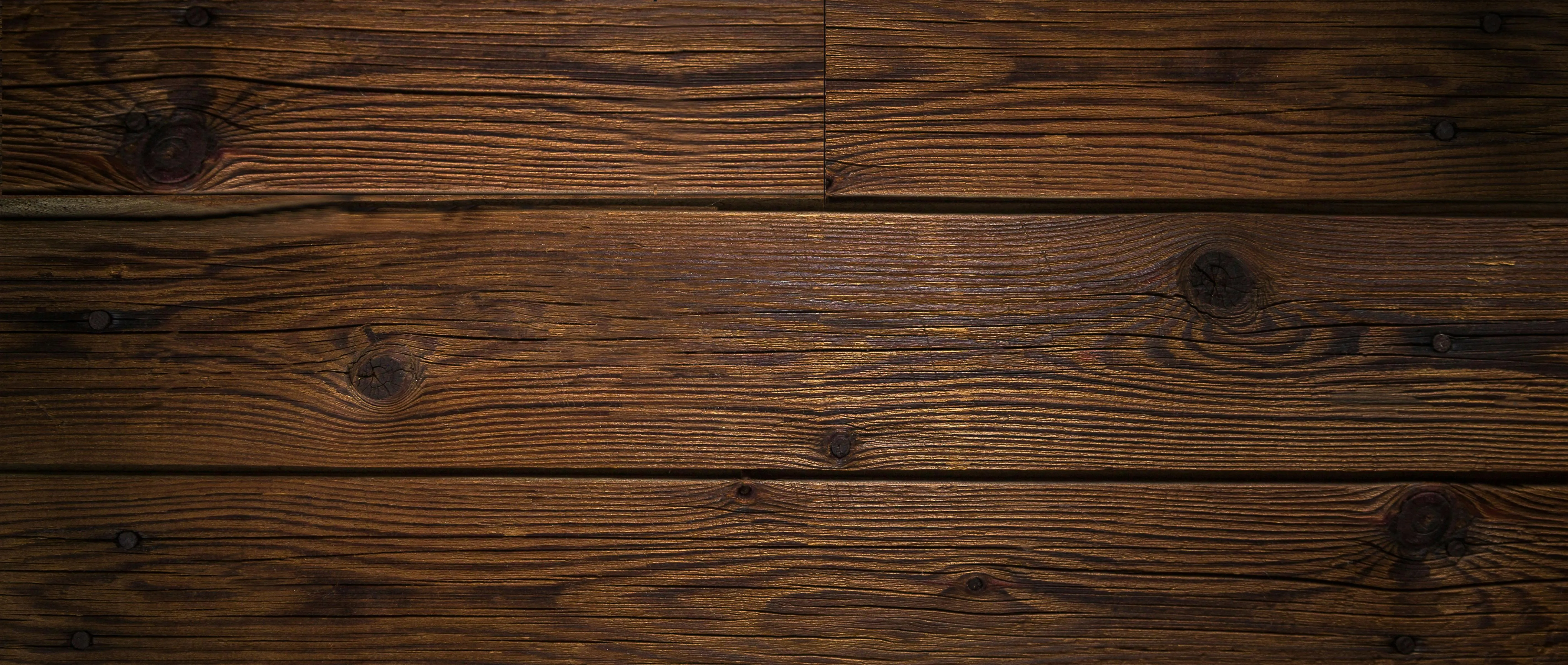 Dark wooden floorboards with natural texture free Wallpaper