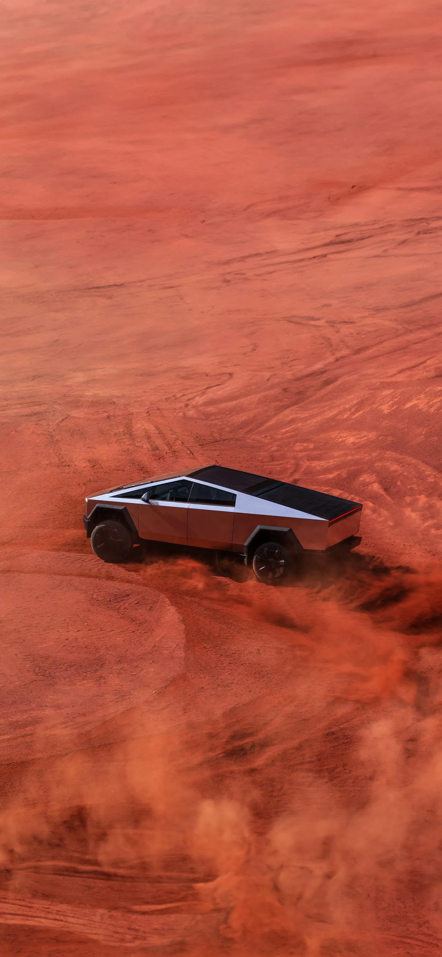 Desert Landscape with Lone Black Car Driving on Sand