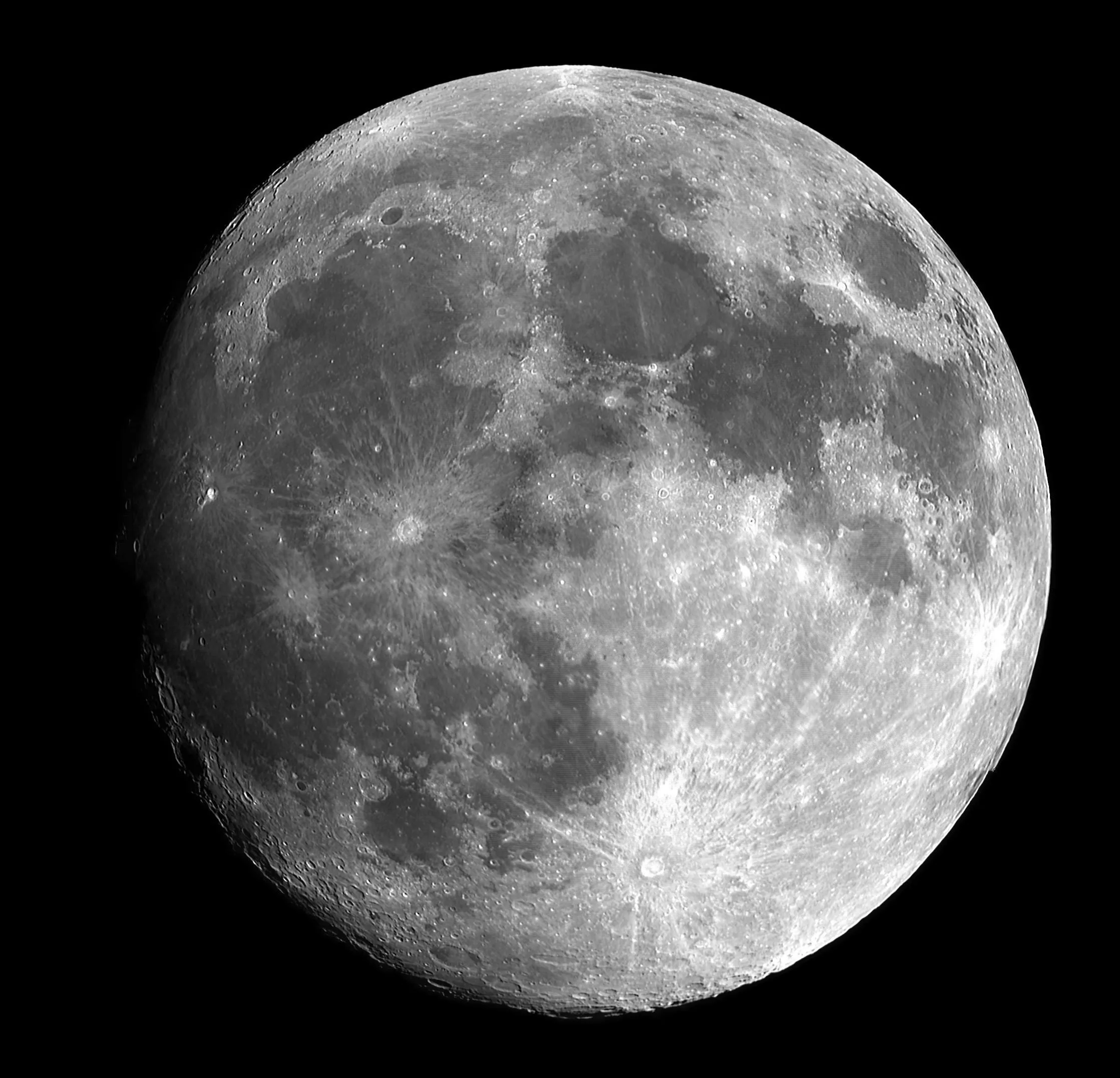 Detailed close up view of the full moon in the dark sky