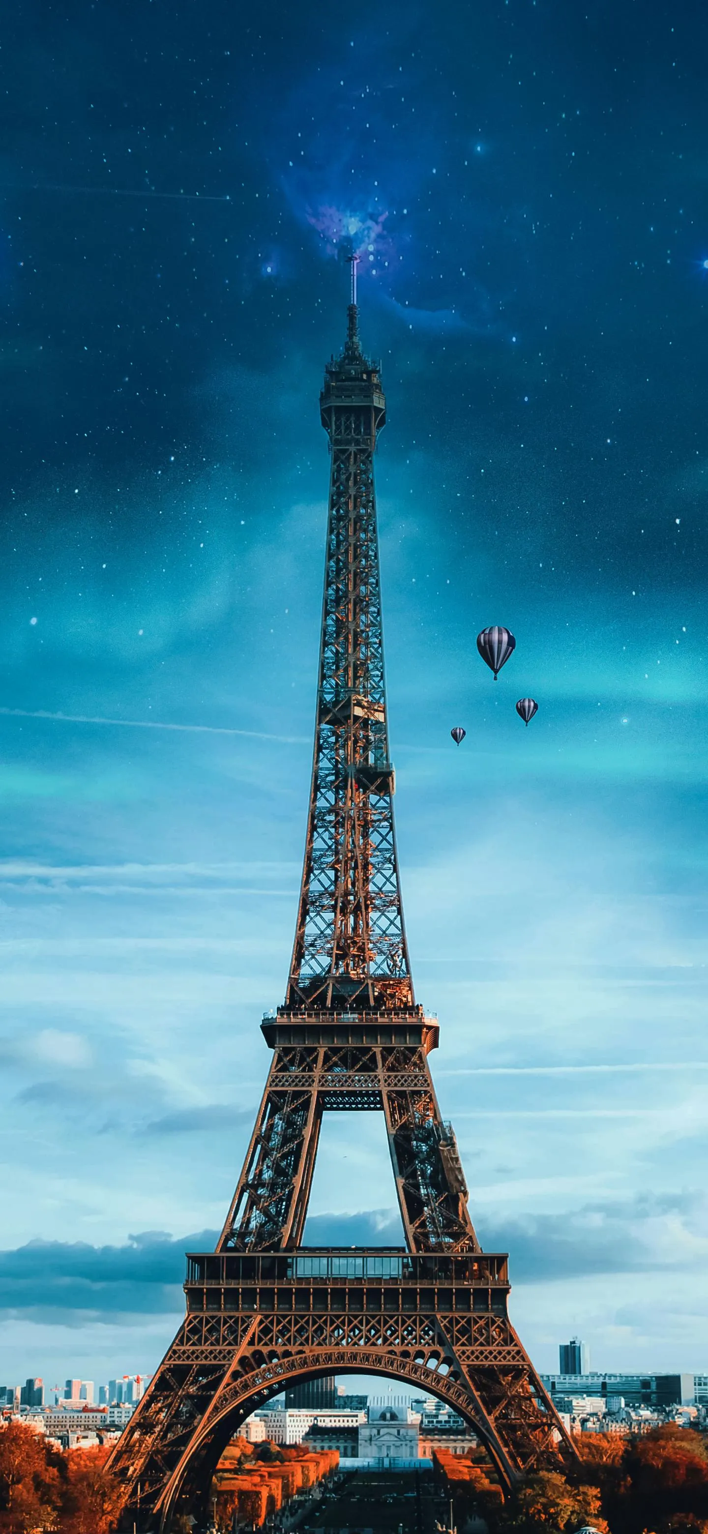 Eiffel Tower Under a Clear Blue Sky with City View Wallpaper