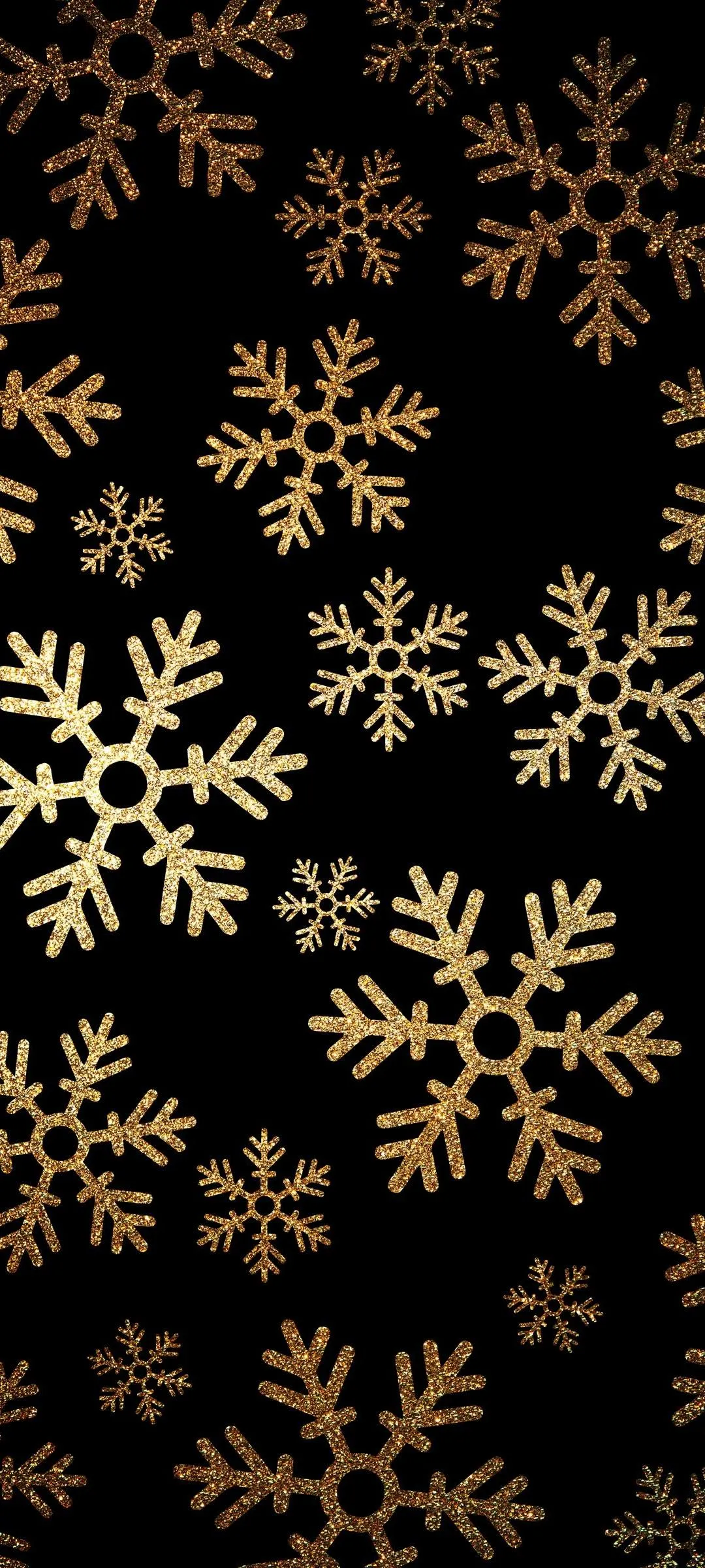 Elegant golden snowflake pattern on black Wallpaper
