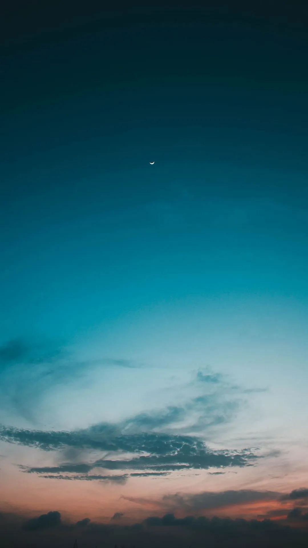 Evening sky with blue and orange tones and soft clouds image
