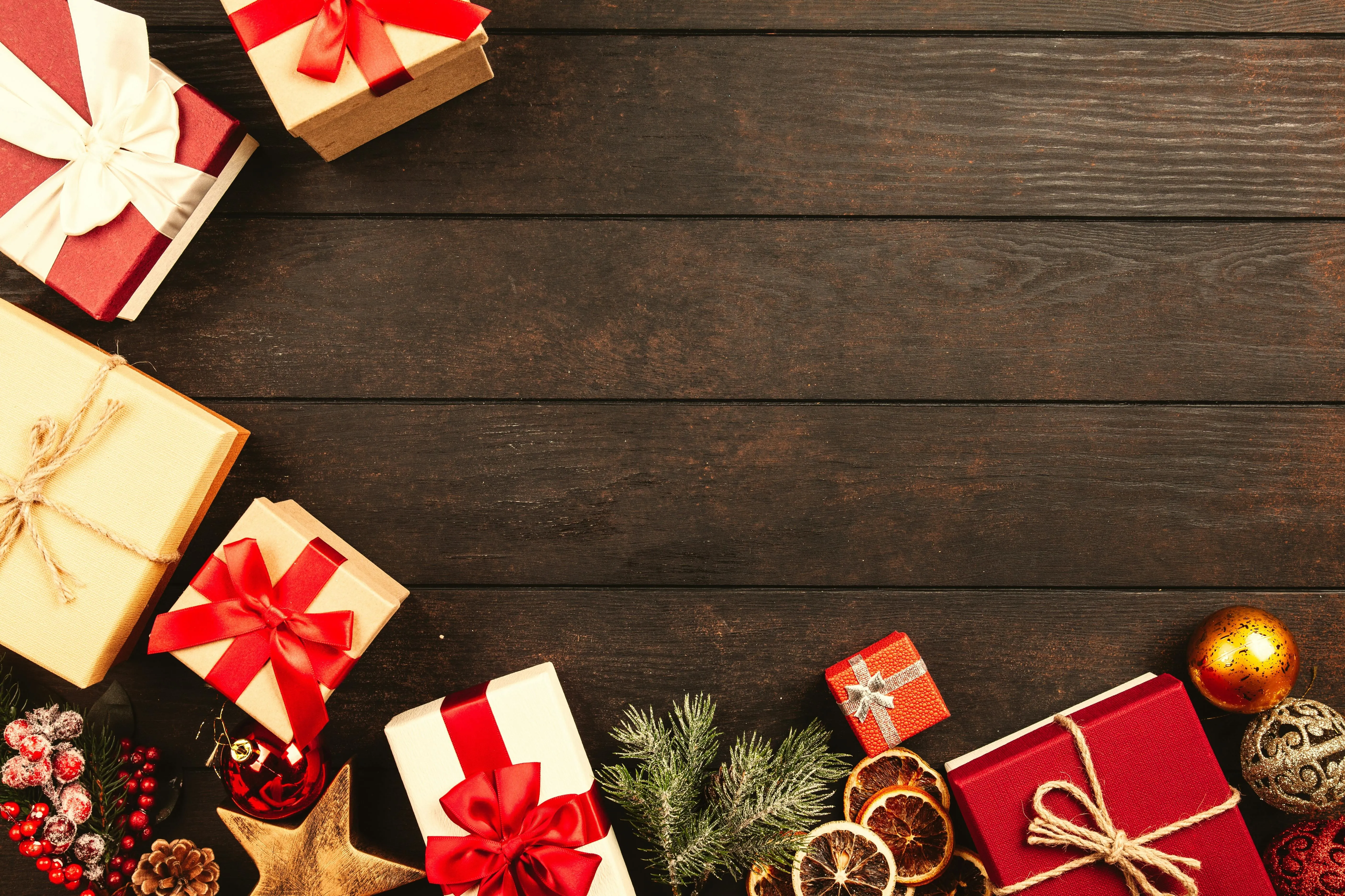 Festive Christmas gifts and decorations on a wooden table